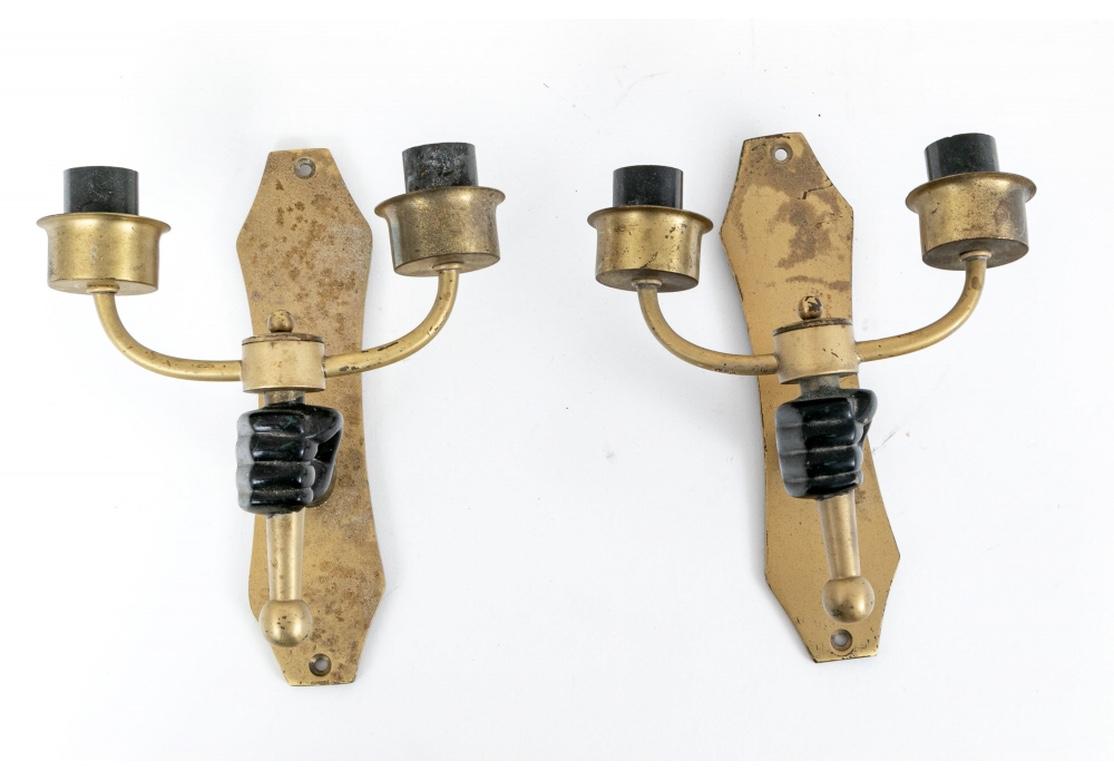 A rare and extraordinary set of four hand sconces reminiscent of the Fantasy style epitomized in his movies by the great French Artist and film maker Jean Cocteau. Marked SA with a half circle. The sconces with angular shaped brass or bronze back