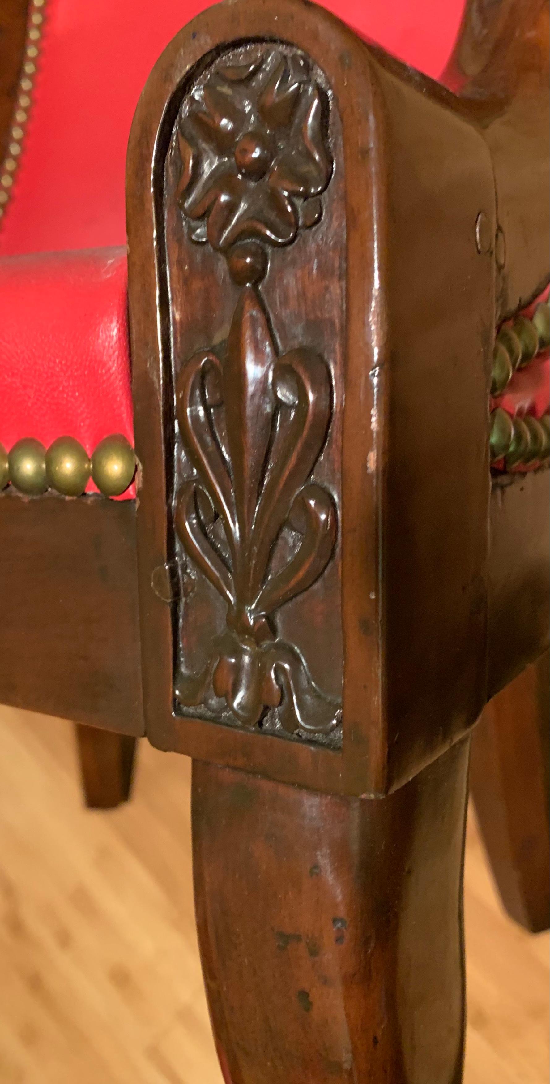 Sculpté à la main Rare ensemble de quatre fauteuils Bergères en acajou sculpté à tête de bélier de style Empire en vente