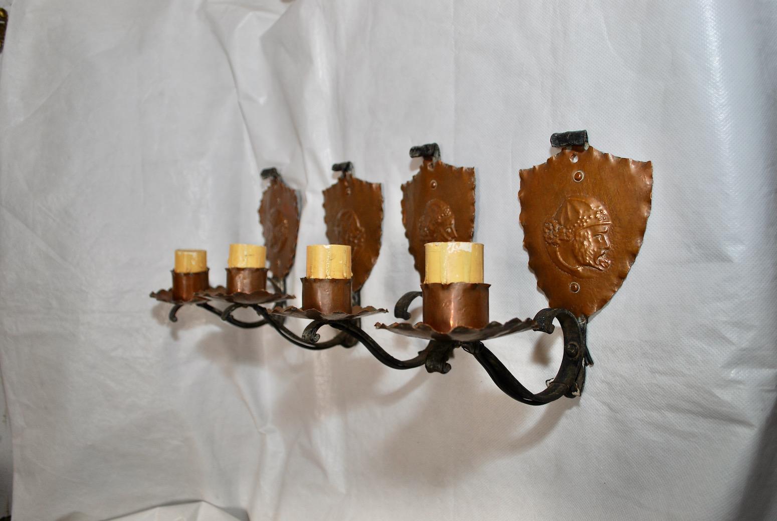 A very nice and rare set of four French 1920's copper and wrought iron sconces, the faces were hands carved, the patina is so much nicer in person.