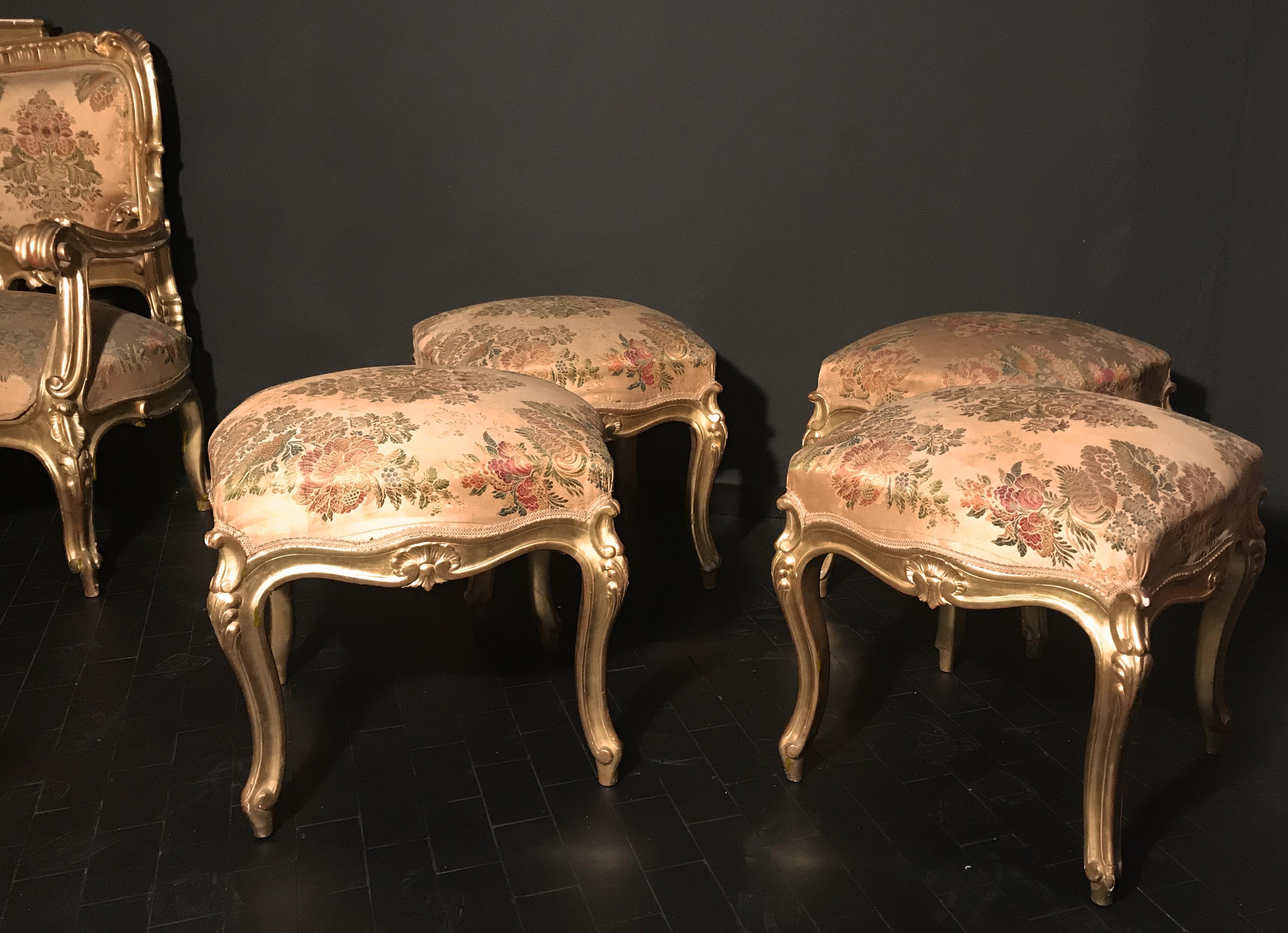 These finely carved and gilded square stools add a beautiful touch to your living spaces. They are carved on all four sides with elegant cabriole legs. Excellent condition of gilding.
This set is part of an eleven piece s salon set published 1stDibs