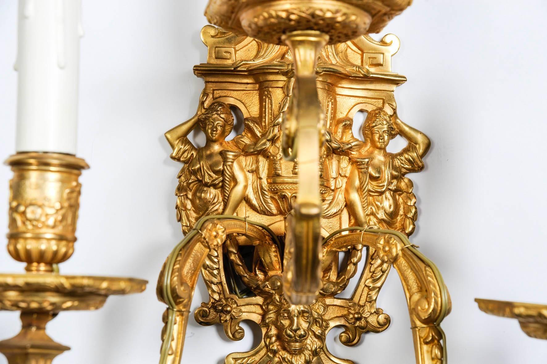 Four gilded bronze sconces in the style of Louis XIV
Two arms of light.