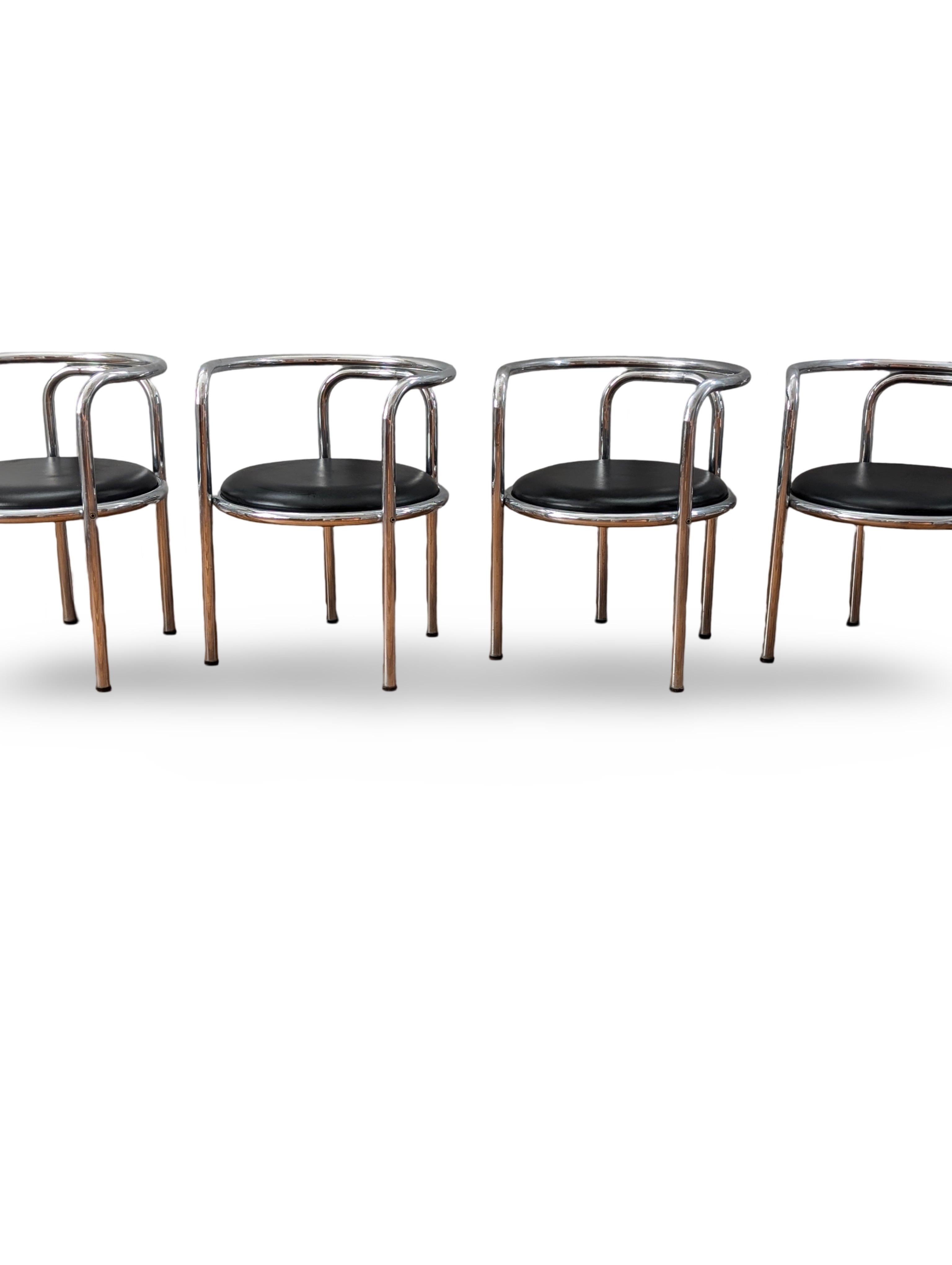 Discover a rare and stunning set of four mid-century modern Locus Solus chairs designed by the iconic Italian architect and designer, Gae Aulenti. This exclusive vintage collection beautifully embodies Aulenti's mastery of fusing form and function,