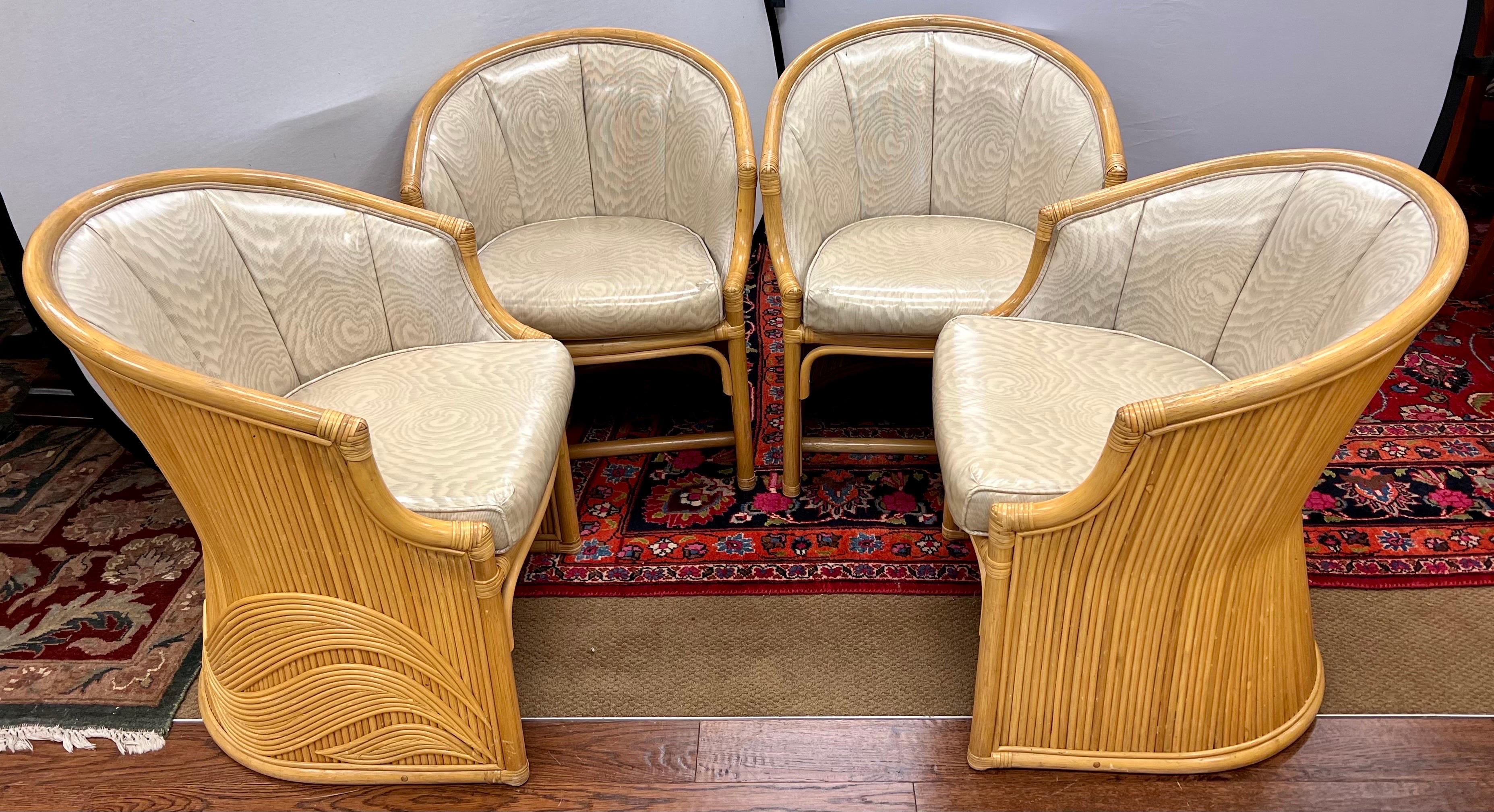Stunning, ultra rare set of Mcguire bamboo dining chairs with gorgeous sculptural design on exterior, see pics. The chairs are upholstered in a neutral vinyl in very good vintage condition. See all pics. Regarding shipping, please reach out to us