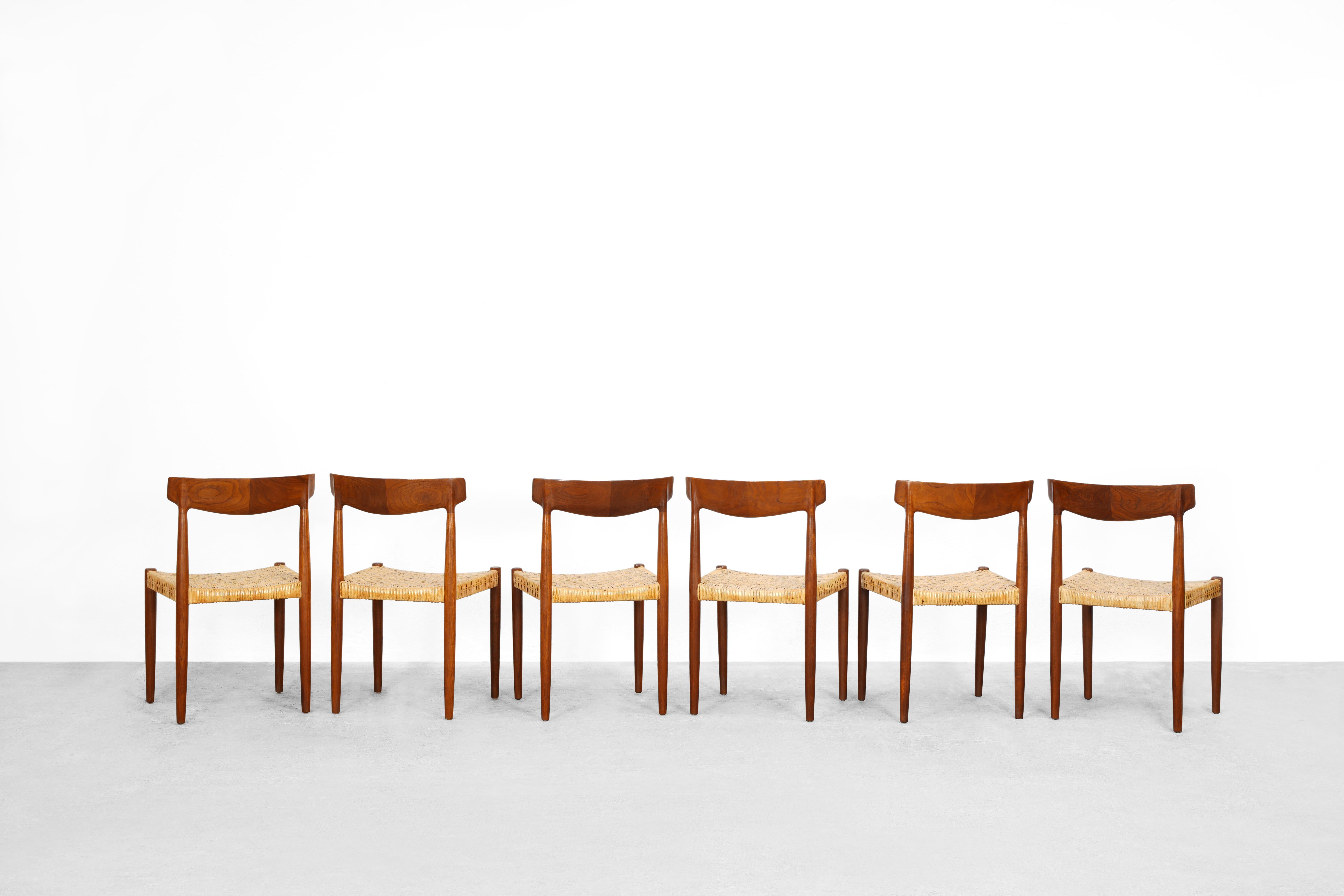 Rare set of six dining chairs model 343 designed by Knud Færch and produced by Slagelse Møbelvaerk in Denmark in the 1960ies. 
All chairs are made out of solid teak and are covered with a cane mesh. Very rare version with the cane mesh!
All six