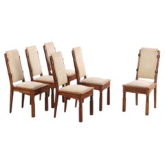 Conjunto poco común de seis sillas de comedor de roble francés, obra de Charles Dudouyt, hacia 1940