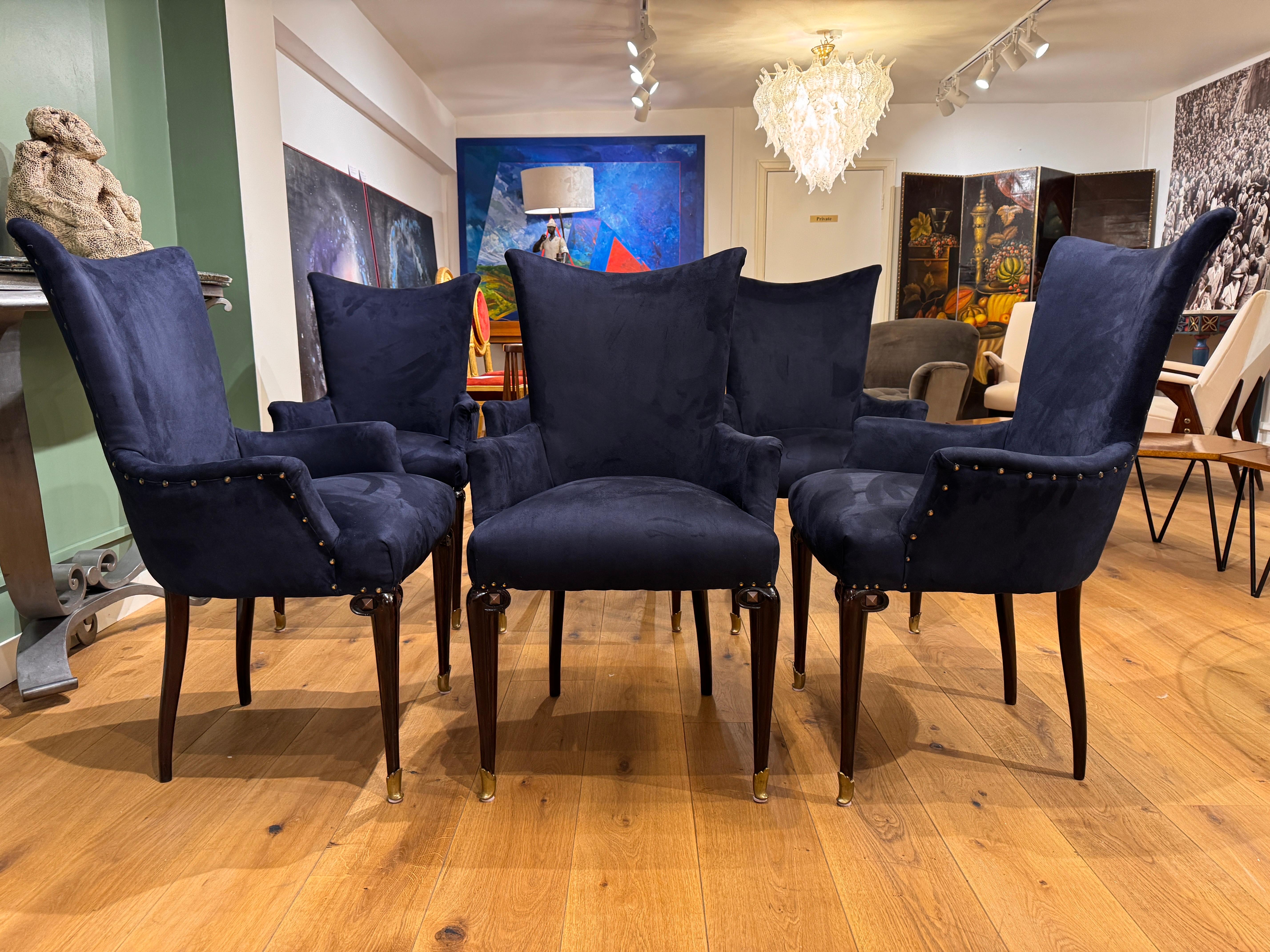 A rare set of six high back dining room chairs with arms . All newly restored and upholstered in midnight blue brushed cotton velvet with antique brass pins to the rear . Dark cherrywood legs with brass sabots & antique bronze studs detailing to the