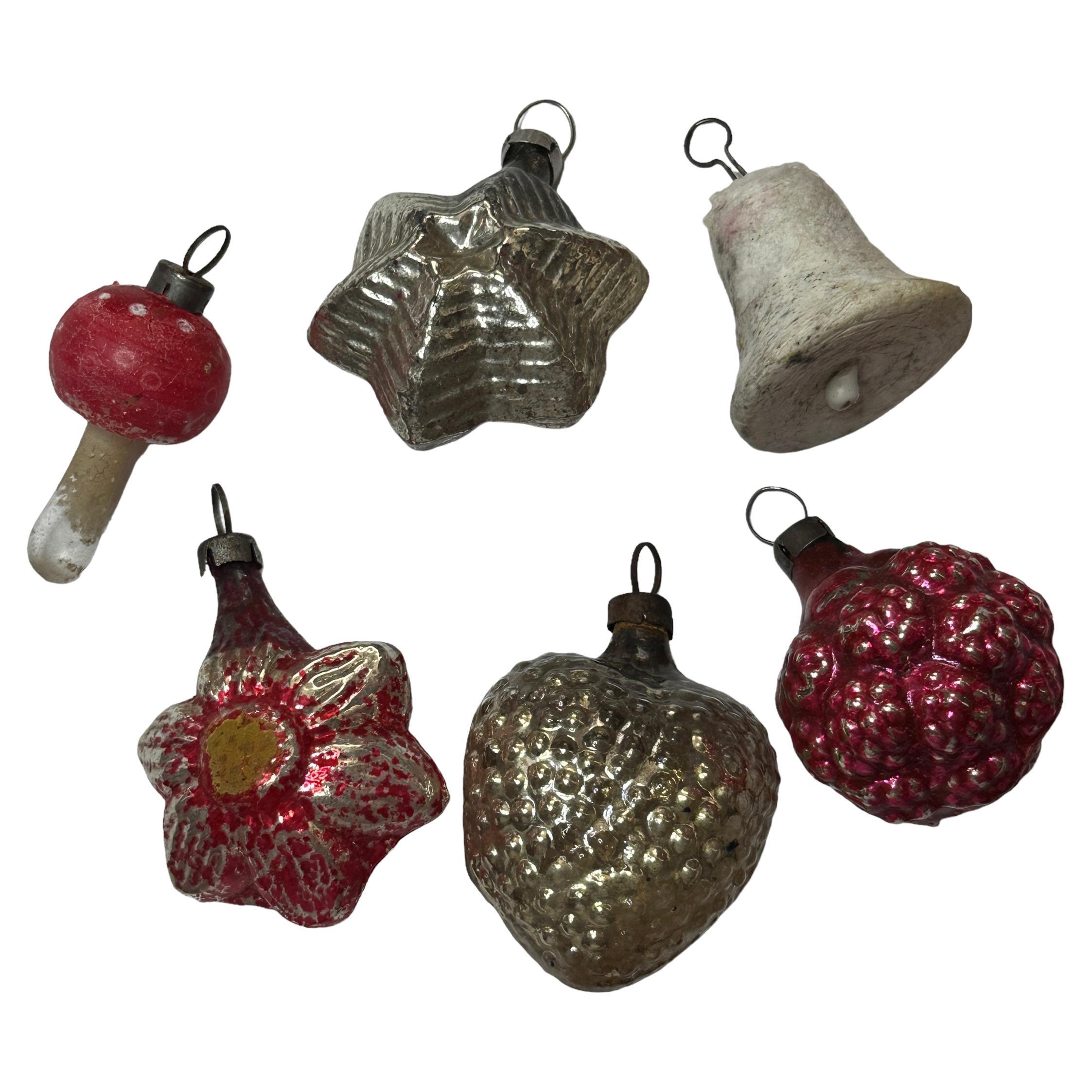 A rare Christmas ornament set from Germany or Austria. Each is made from mouth blown glass, one of pressed cotton, this would be a great addition for your Christmas or feather tree. Size always given for the tallest item in the pictures. Age approx.