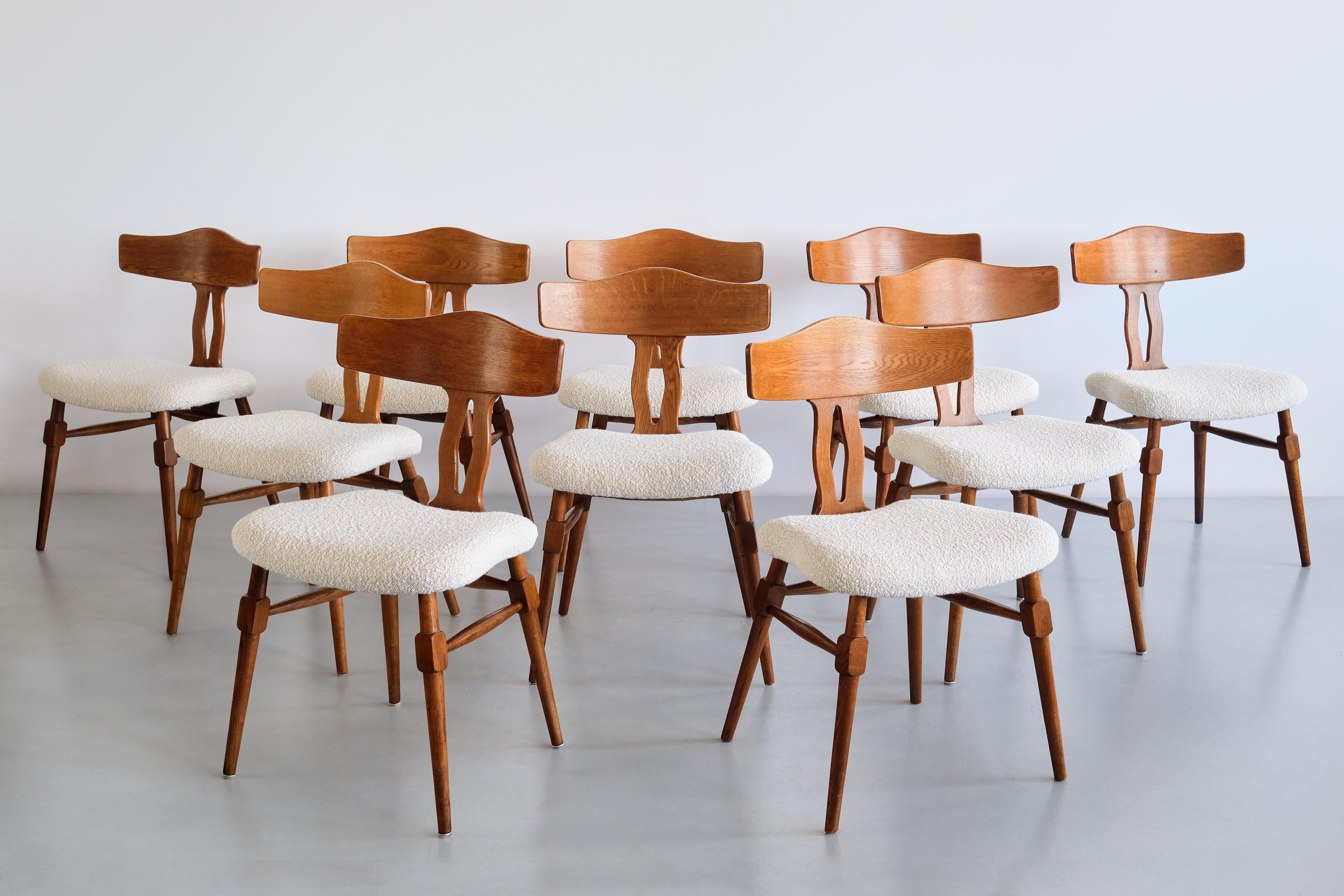 This rare set of dining room chairs was designed by Henning (Henry) Kjærnulf in the late 1950s. The chairs were produced by Nyrup Møbelfabrik in Denmark.

The set consists of ten chairs made of solid oak with a beautiful grain and colour. The