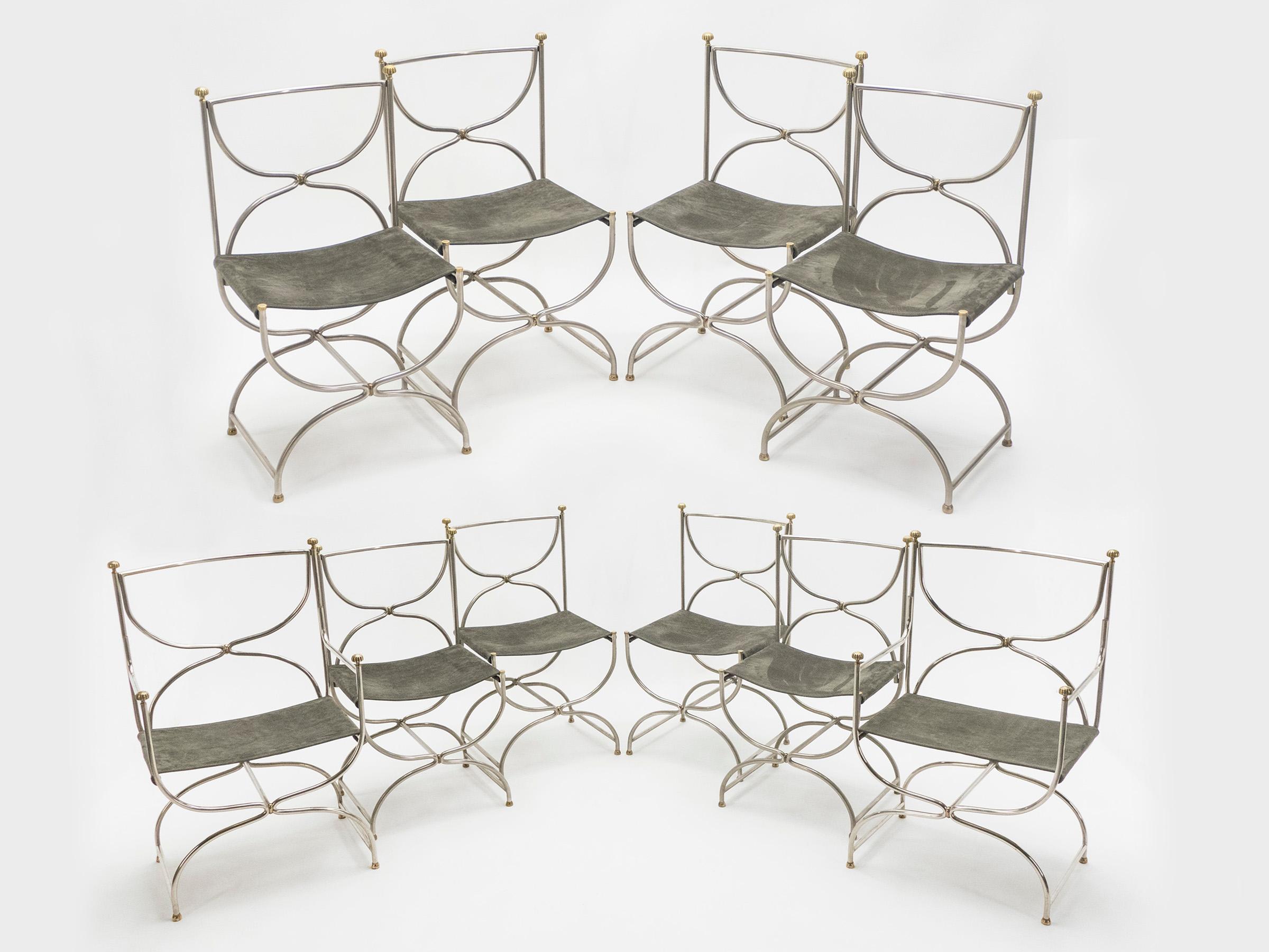 Beautiful set of 1960s Curule Savonarola chairs made of heavy stainless steel metal with brass accents. This incredible set of eight chairs plus two chairs with armrests was created by French interior design firm Maison Jansen. The sparse original