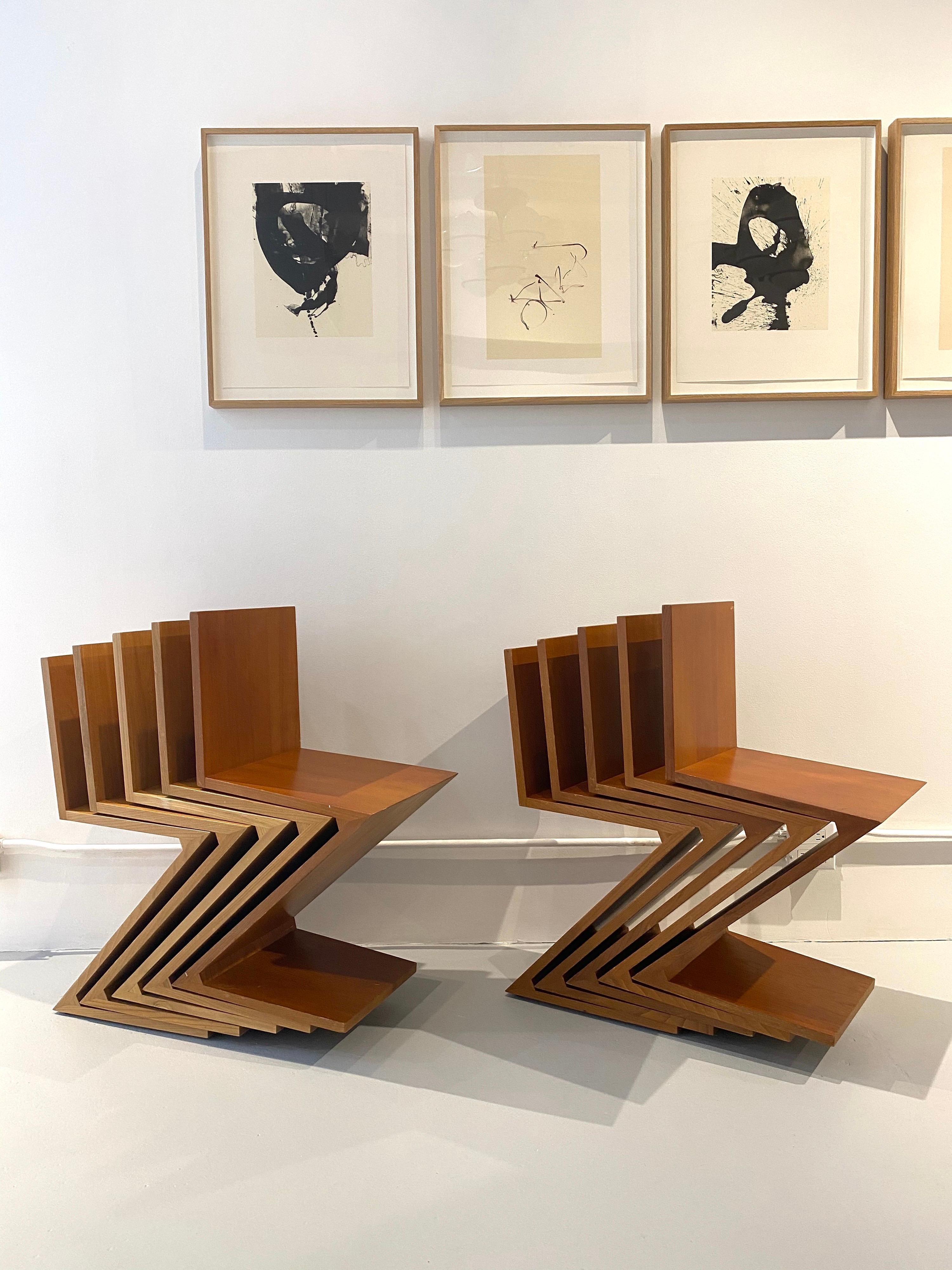 Set of ten first edition for Cassina, 1973 Gerrit Rietveld Zig Zag chairs.
The chairs are in completely original condition, sturdy and solid. Each one is marked with an early Cassina stamp.
Six of the chairs are in a medium stain and four are