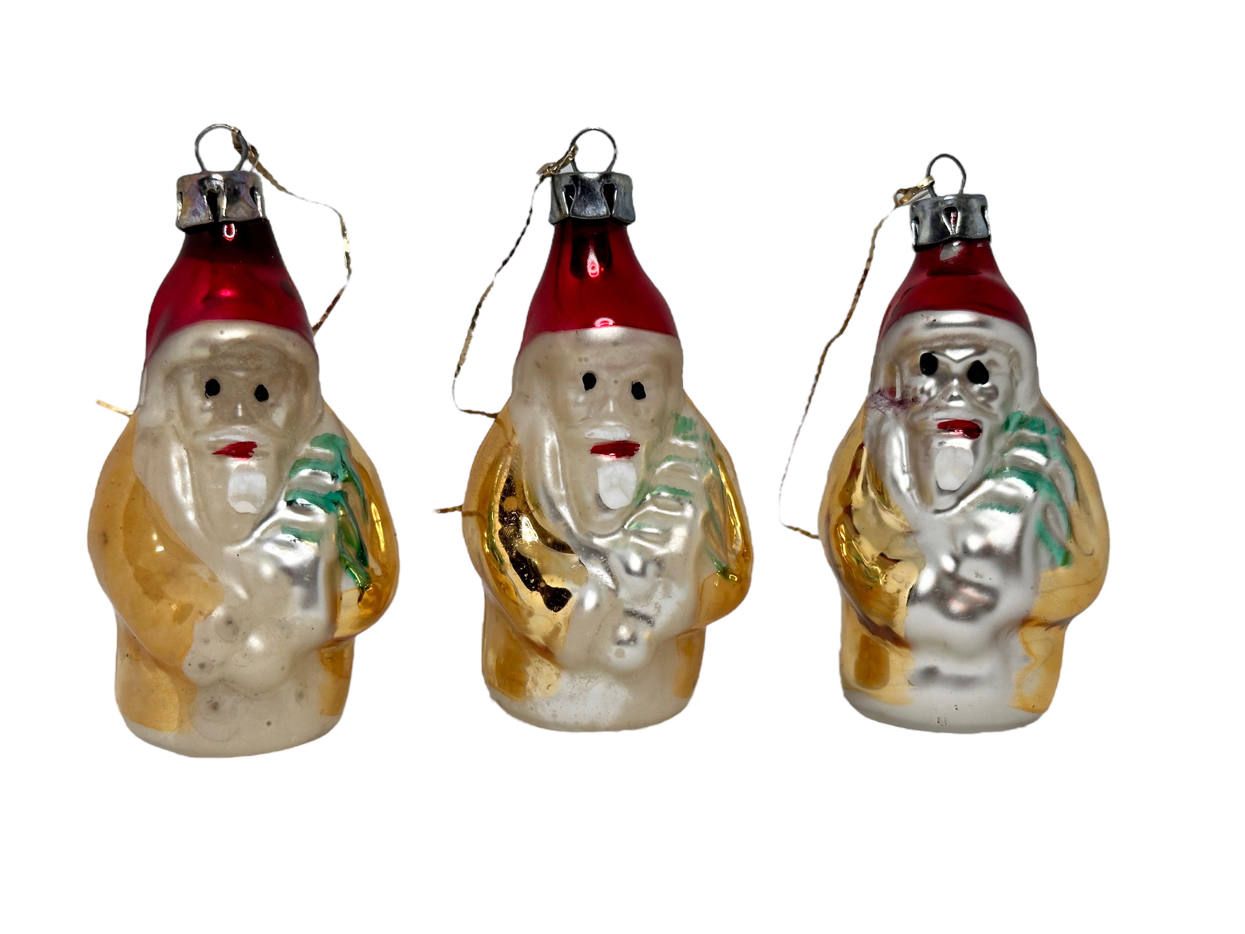 A rare Christmas ornament set of three. Each is made from mouth blown glass, this would be a great addition for your Christmas or feather tree. Size always given for the tallest item in the pictures. Age approx. 1930s to 1940s. Found at an estate