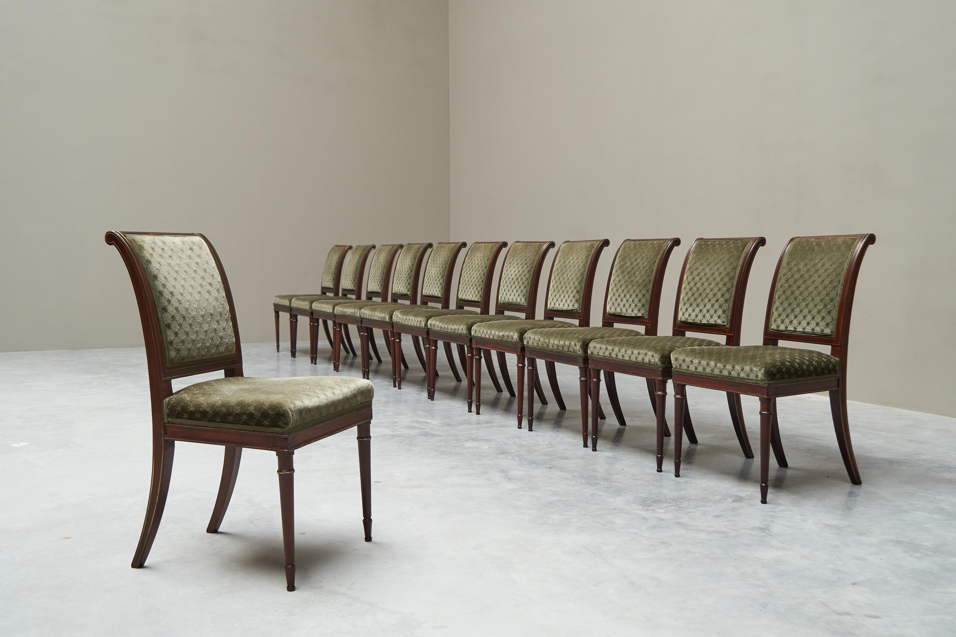 Rare Set of Twelve Early 19th Century Empire Dining Chairs in Mahogany, Inlaid Brass and Velvet

This is a very large and rare set of twelve elegant dining chairs from the (late) ‘empire’ / ‘restoration’ period - early 19th century