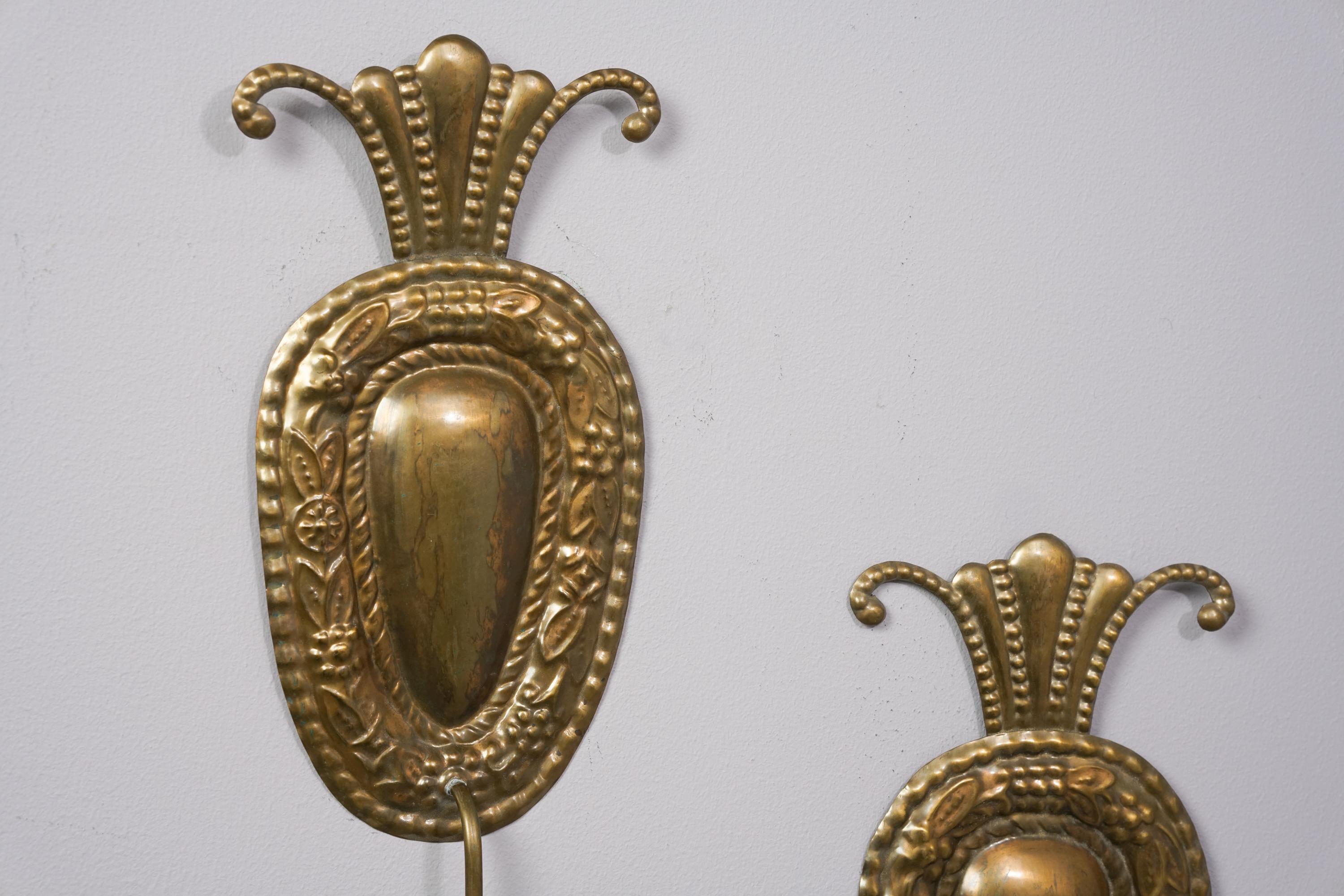 Rare set of two Paavo Tynell Art Deco candle sconces for Taito Oy from the 1920s/1930s. Brass. Good vintage condition, minor wear and patina consistent with age and use. The candle sconces are sold as a set.