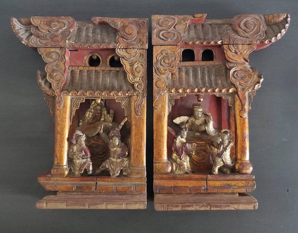 An original matched pair of exceptionally carved Chinese temple architectural ornaments, the ornate decorative brackets salvaged from an early Qing Dynasty temple, the richy detailed palace scene with figural elements believed to be designed after