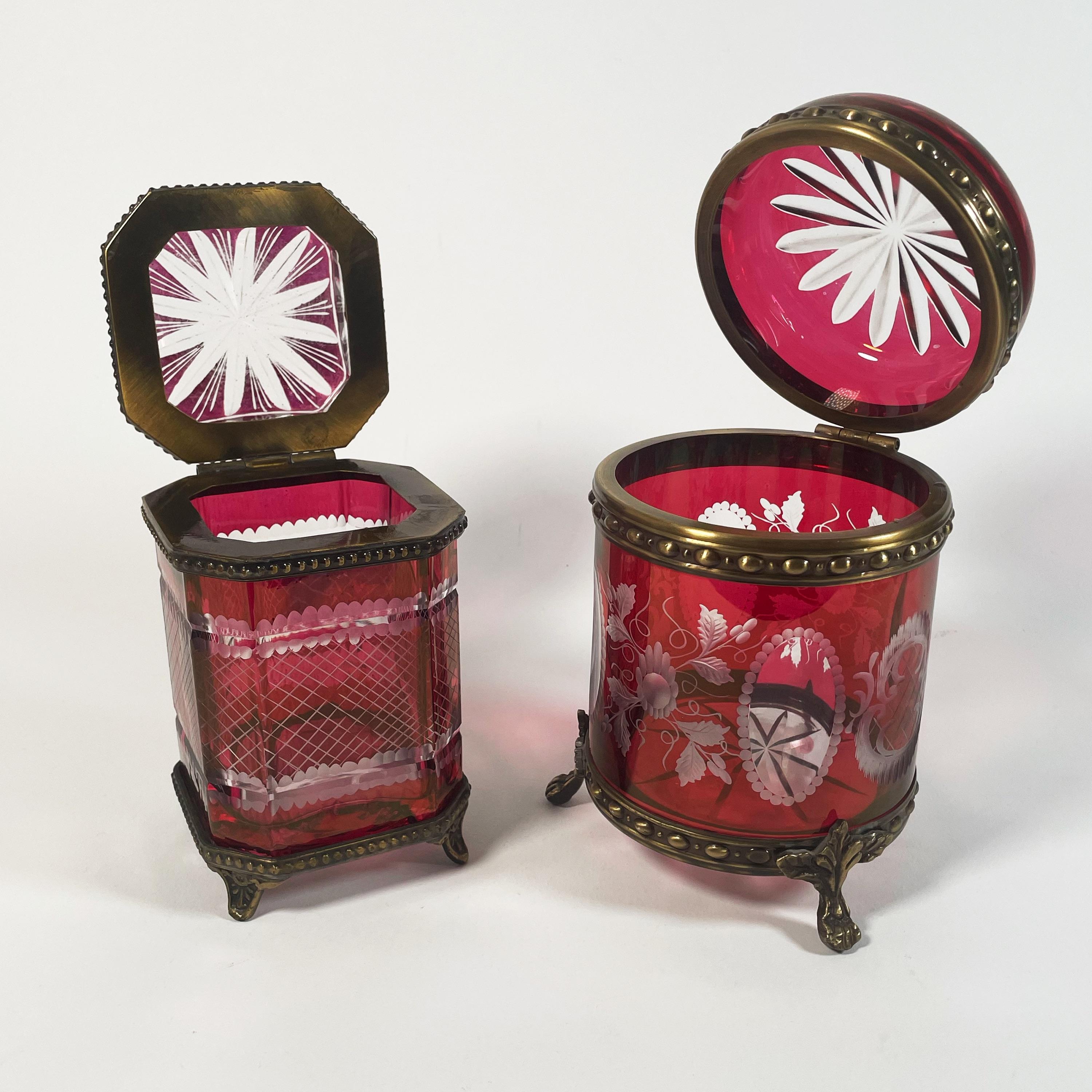 Indulge in the beauty of this rare set of two exquisite candy boxes, crafted from stunning hand-cut Bohemian crystal and adorned with elegant bronze accents. Dating back to the 1900s, this collection features a square box measuring 15 cm in height