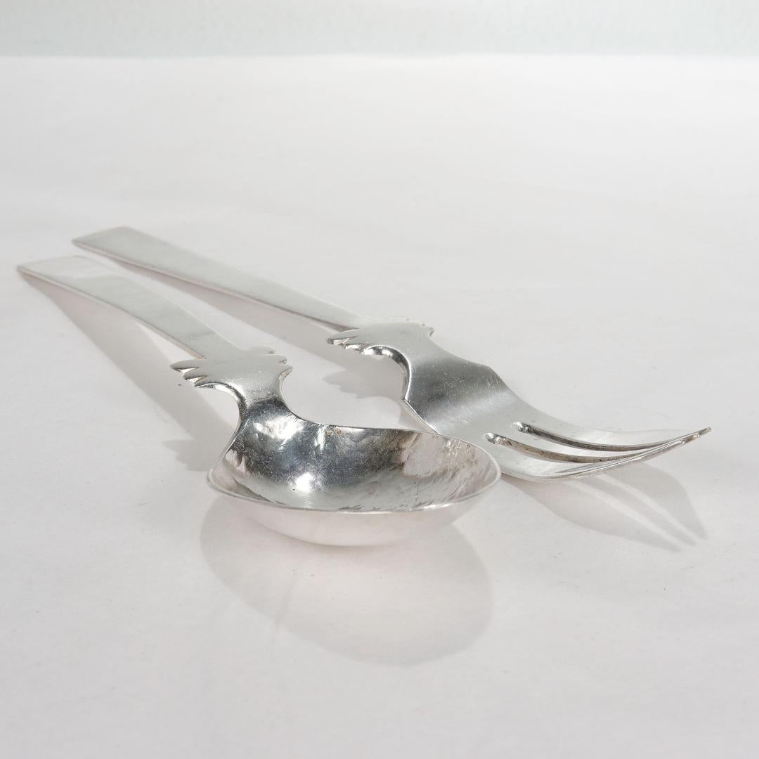 A fine early Taxco salad serving set.

In sterling silver.

By William Spratling.

With a wonderful hand-hammered surface to the bowl.

Simply a wonderful pair of silver serving utensils!

Date:
1940s - 1950s

Overall Condition:
It is in overall