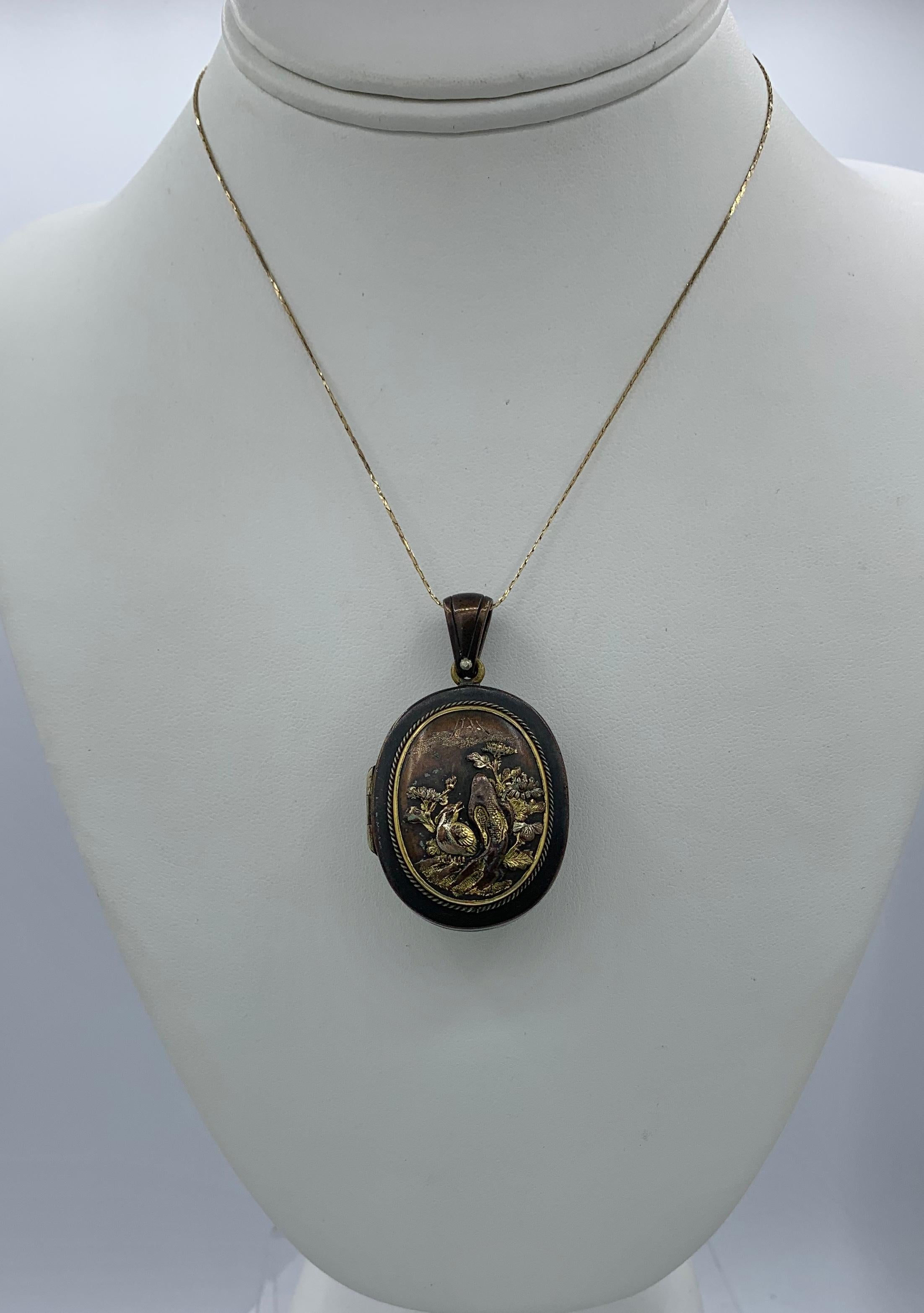 Rare Shakudo Locket Pendant Necklace Bird Rickshaw Mount Fuji Japan Antique In Excellent Condition For Sale In New York, NY