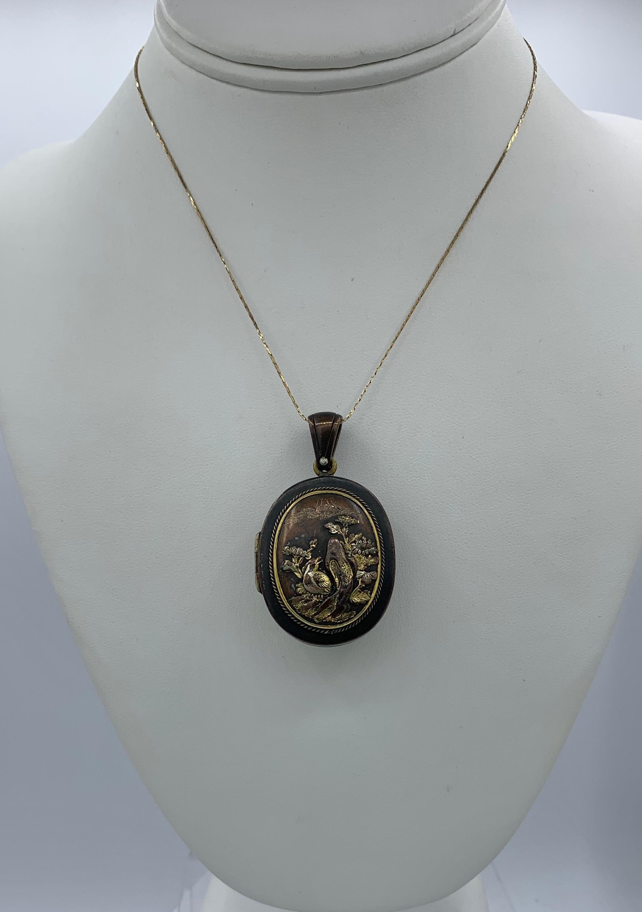Rare Shakudo Locket Pendant Necklace Bird Rickshaw Mount Fuji Japan Antique In Excellent Condition In New York, NY