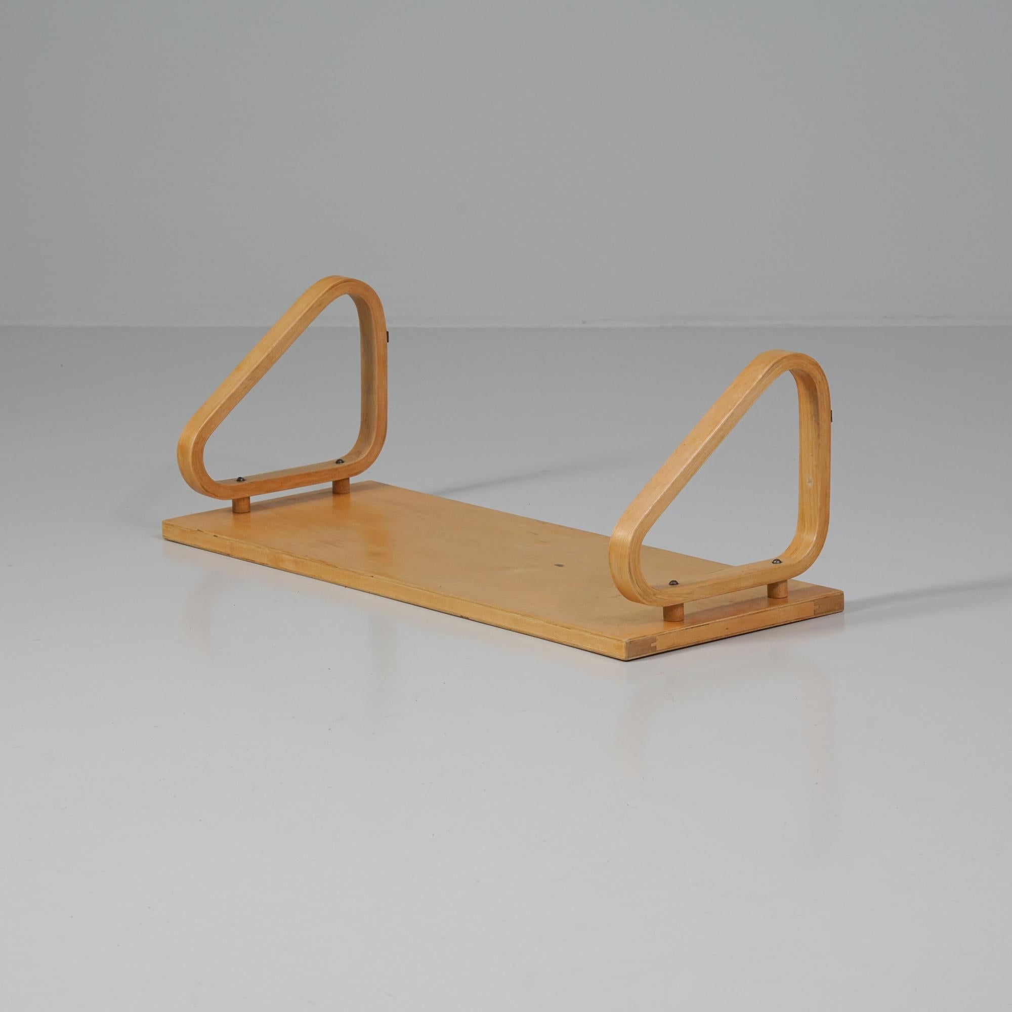 Rare shelf, designed by Alvar Aalto, manufactured by Oy Huonekalu- ja Rakennustyötehdas Ab, 1950s. Birch. Rare size. Good vintage condition, patina consistent with age and use. 

Alvar Aalto (1898-1976) is probably the most famous Finnish architect