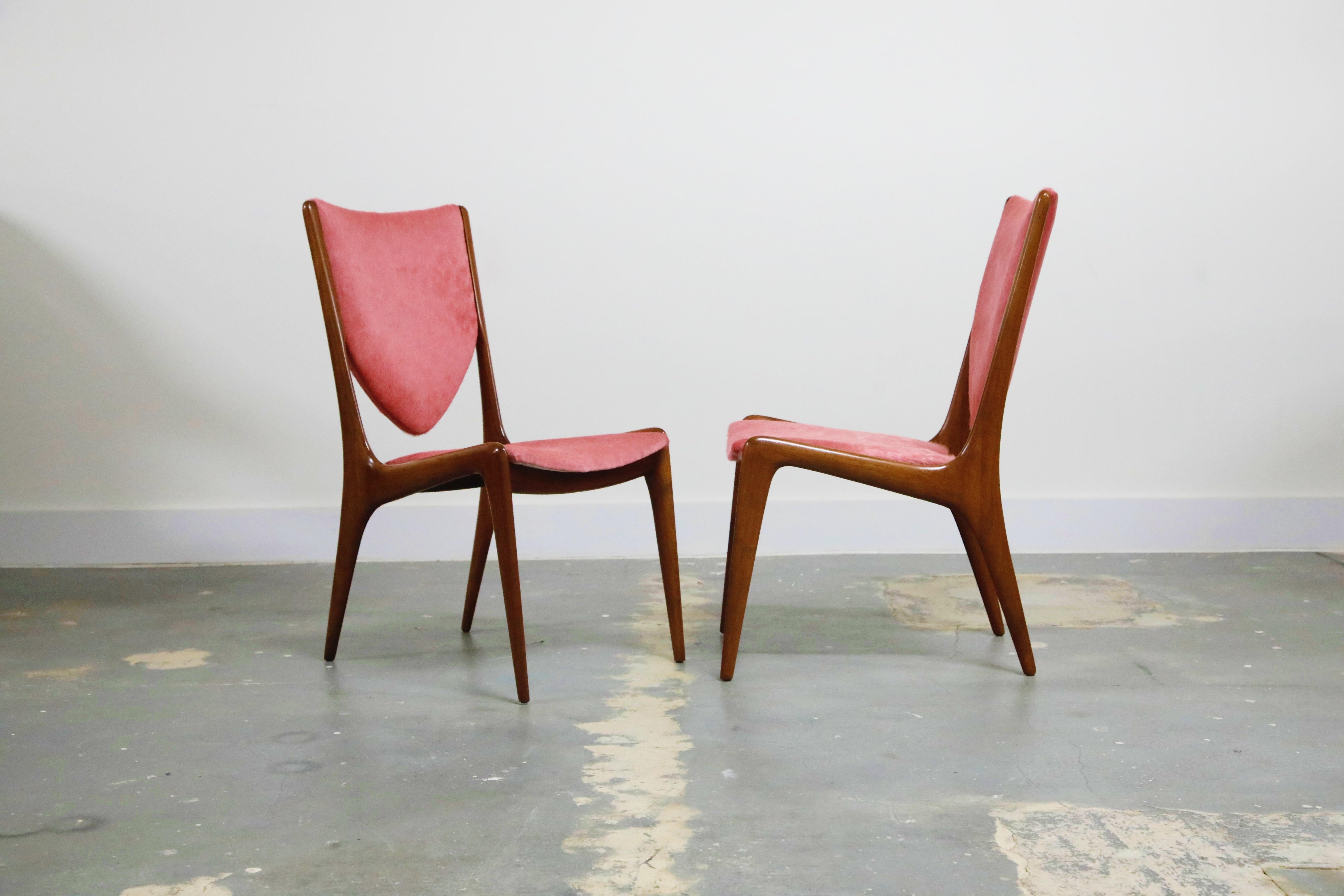 Attention those who want the absolute best of the best of the best, your chairs have arrived. This pair of very rare and highly sought-after model #VK-103 'Shield Back' chairs by Vladimir Kagan for Kagan-Dreyfuss is crafted from sculpted walnut and