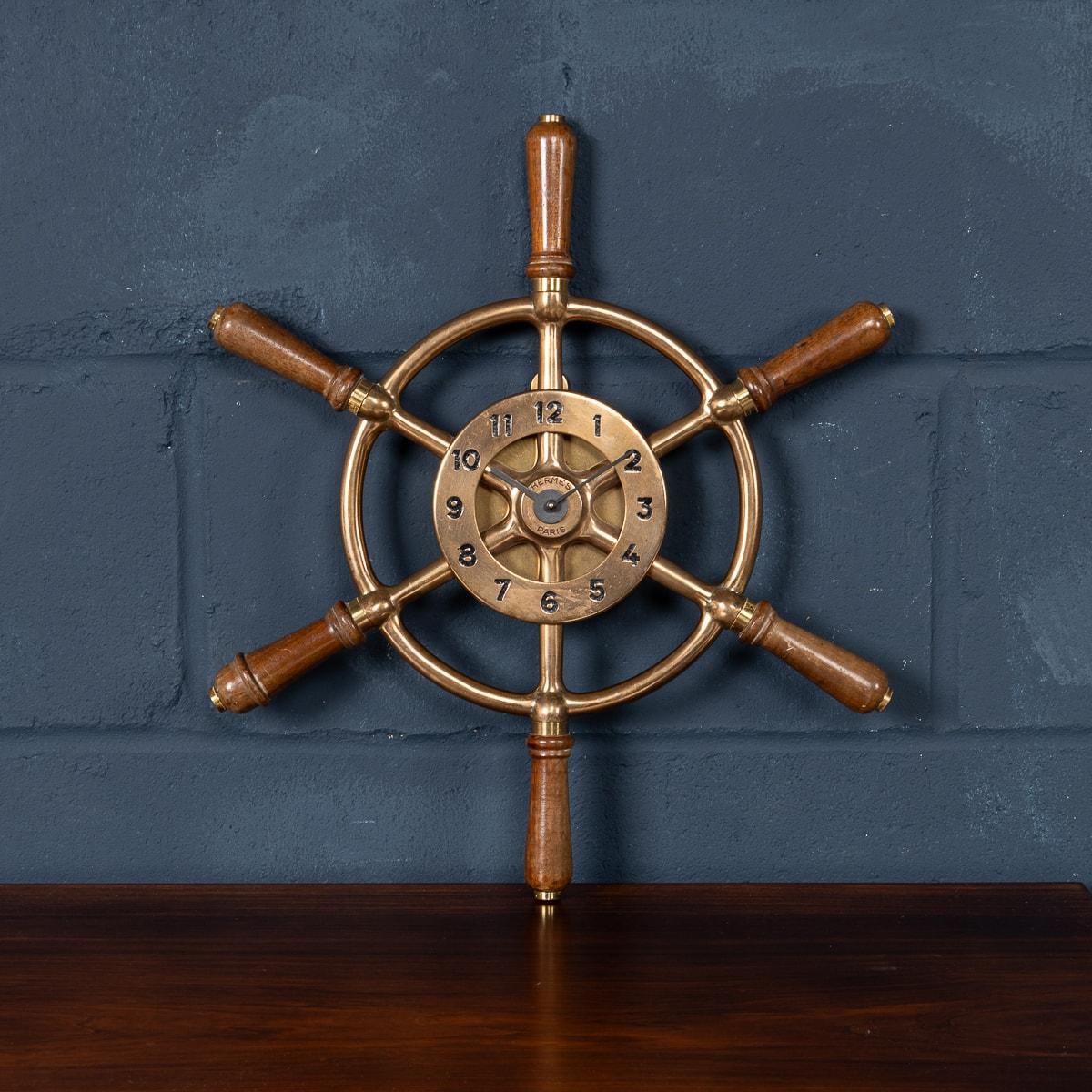 A rare and original 20th Century vintage Hermes Paris “Gouvernail” ship’s wheel wall clock. The clock encases an 8-day mechanical movement, made probably by Jaeger LeCoultre (usually all Hermes clocks used JLC movements). Hermes introduced this