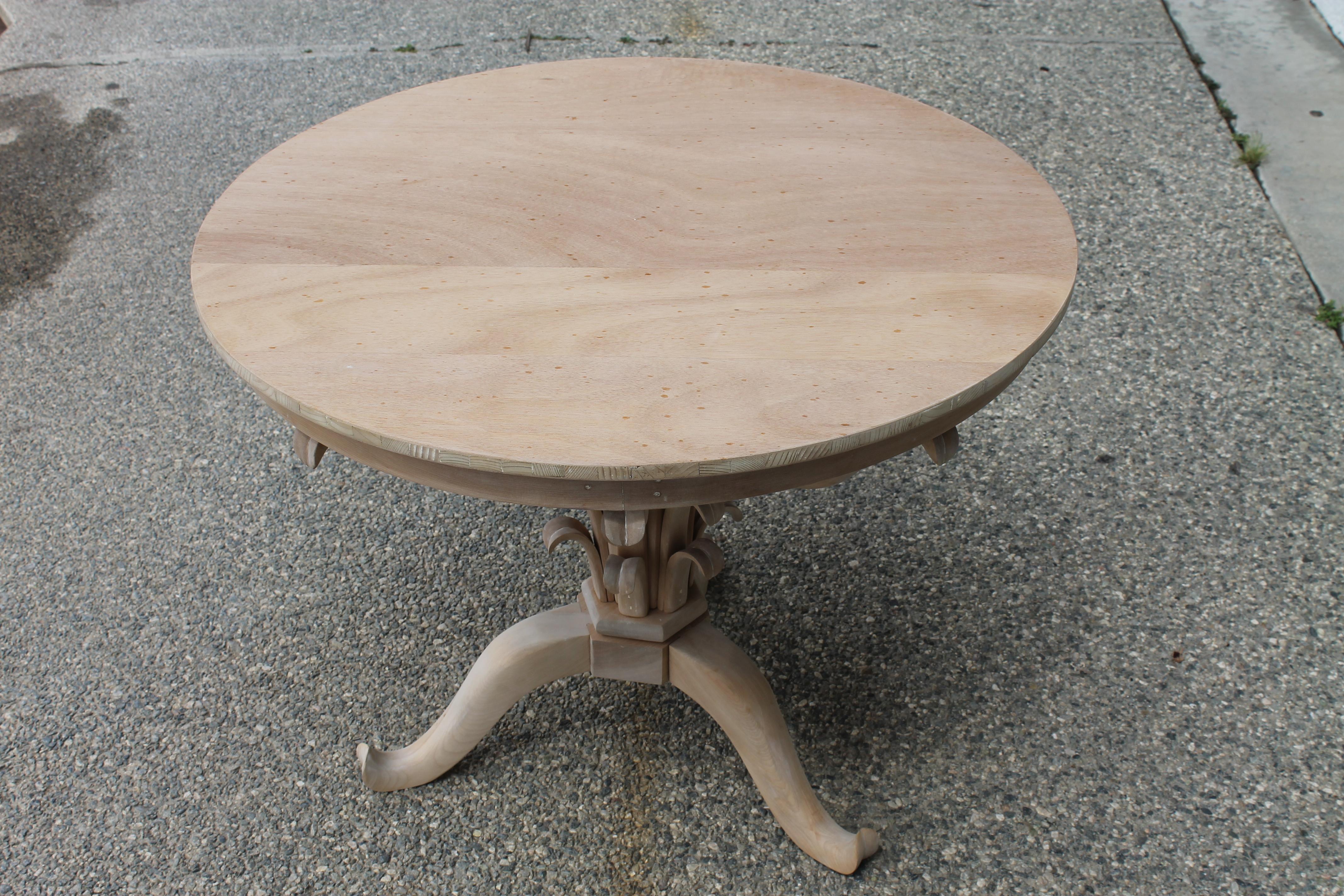 Occasional table that we believe was designed by T.H. Robsjohn-Gibbings and produced by the Widdicomb Furniture Company, Grand Rapids, Michigan. Gibbings table measures 31” diameter and 24.25” high. We had the table stripped of old paint and it