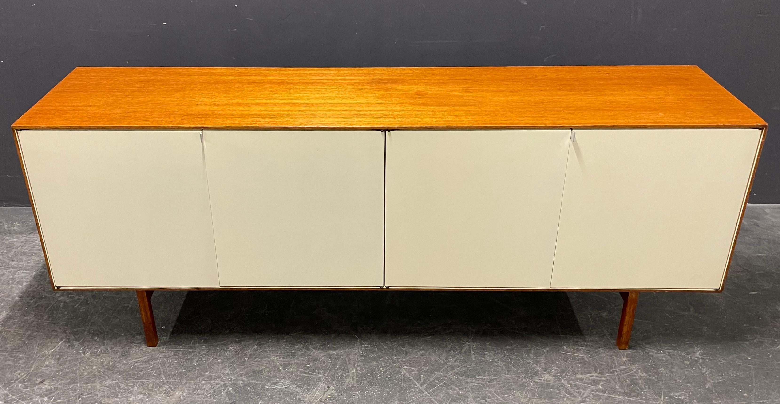 In my opinion the nicest sideboard of Florence Knoll. wonderful clear lines and a elegant touch. 
does have a real back and can be used as room divider.