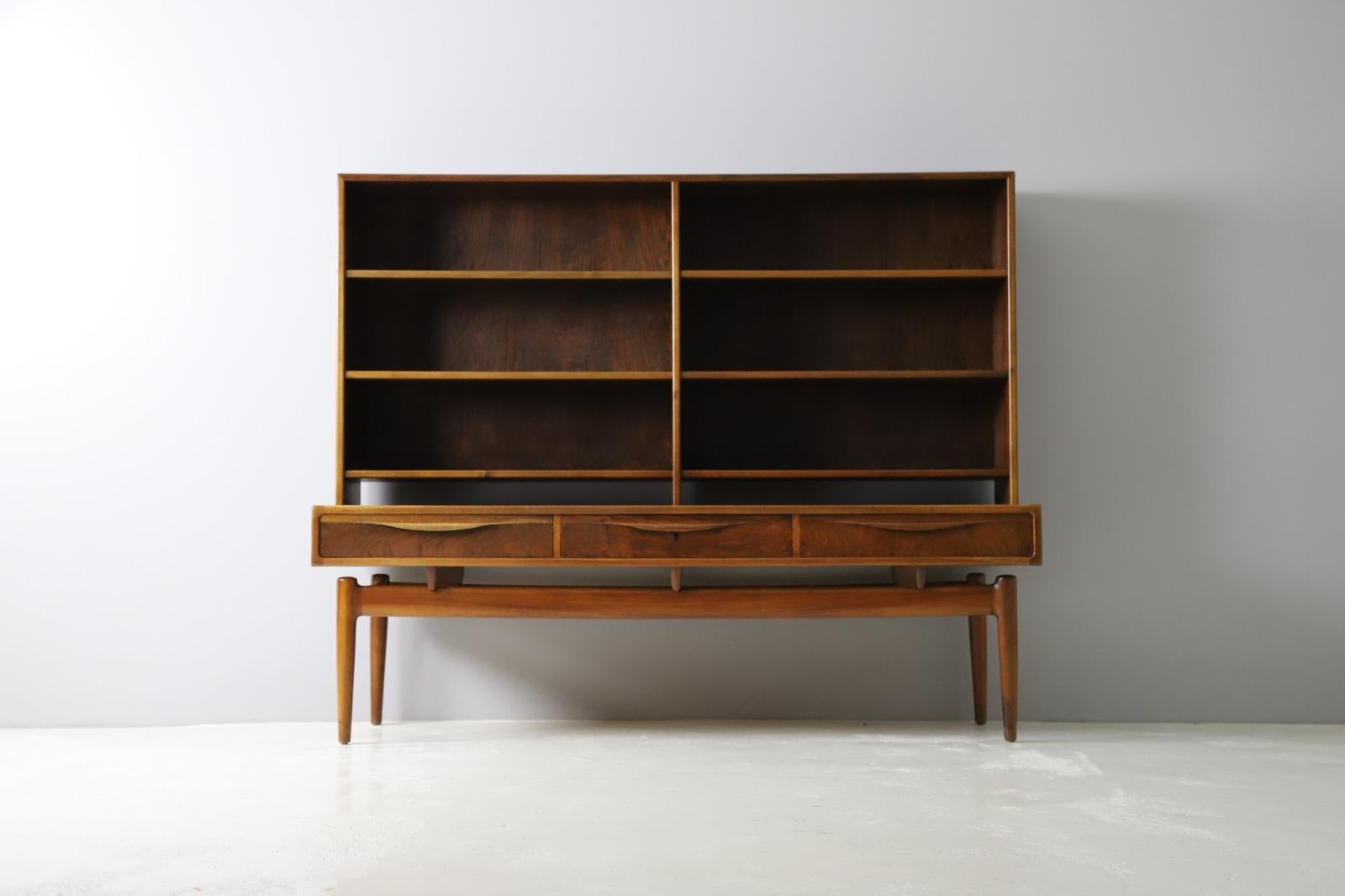 Very rare and special sideboard with top cabinet by Kurt Østervig for Brande Møbelindustri, Denmark 1950s. 
Top quality walnut veneer with a beautiful grain all over. Can also be used separately as a low sideboard and a floor standing bookcase.