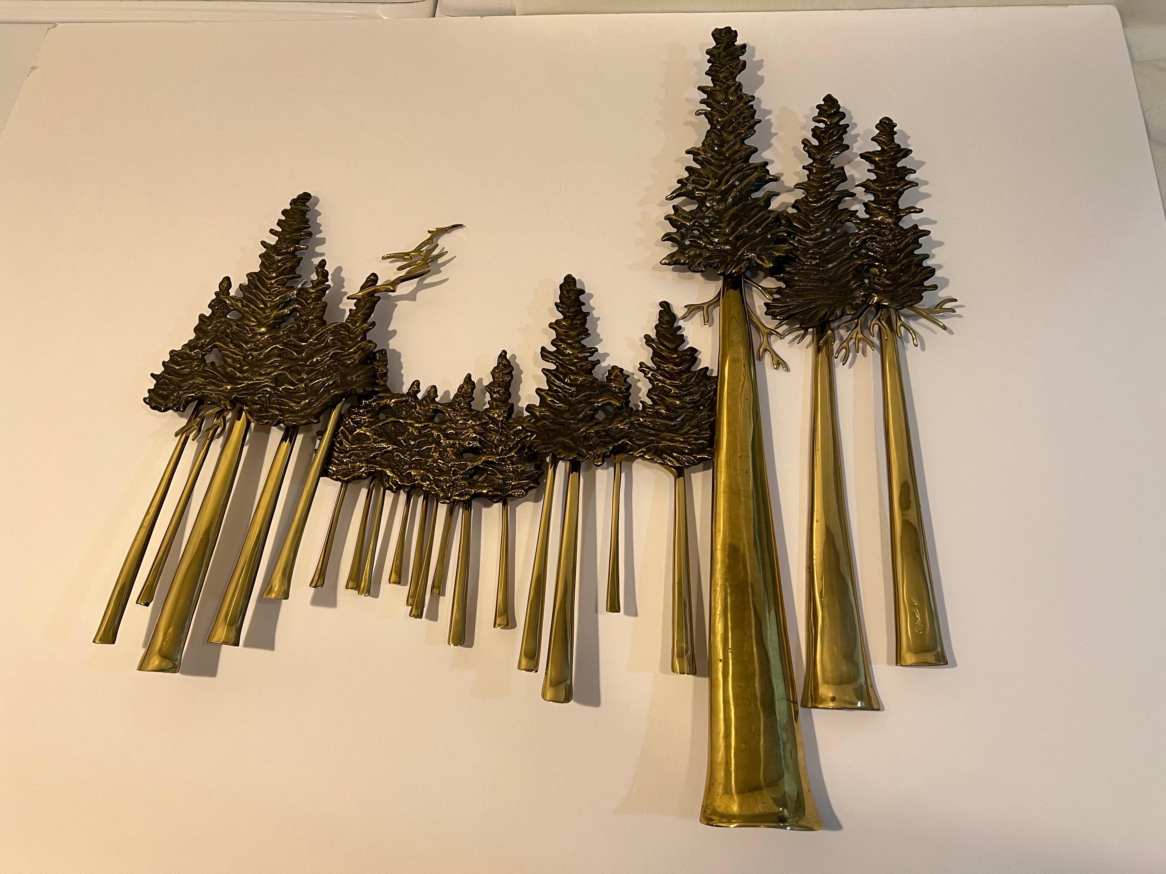 Rare Signed brass tree wall sculpture by Bijan. Solid brass sculpture of Pine Trees and birds at the top. Signed on the front and the back. This hard to find piece would be a great sculpture for that collector who has everything.