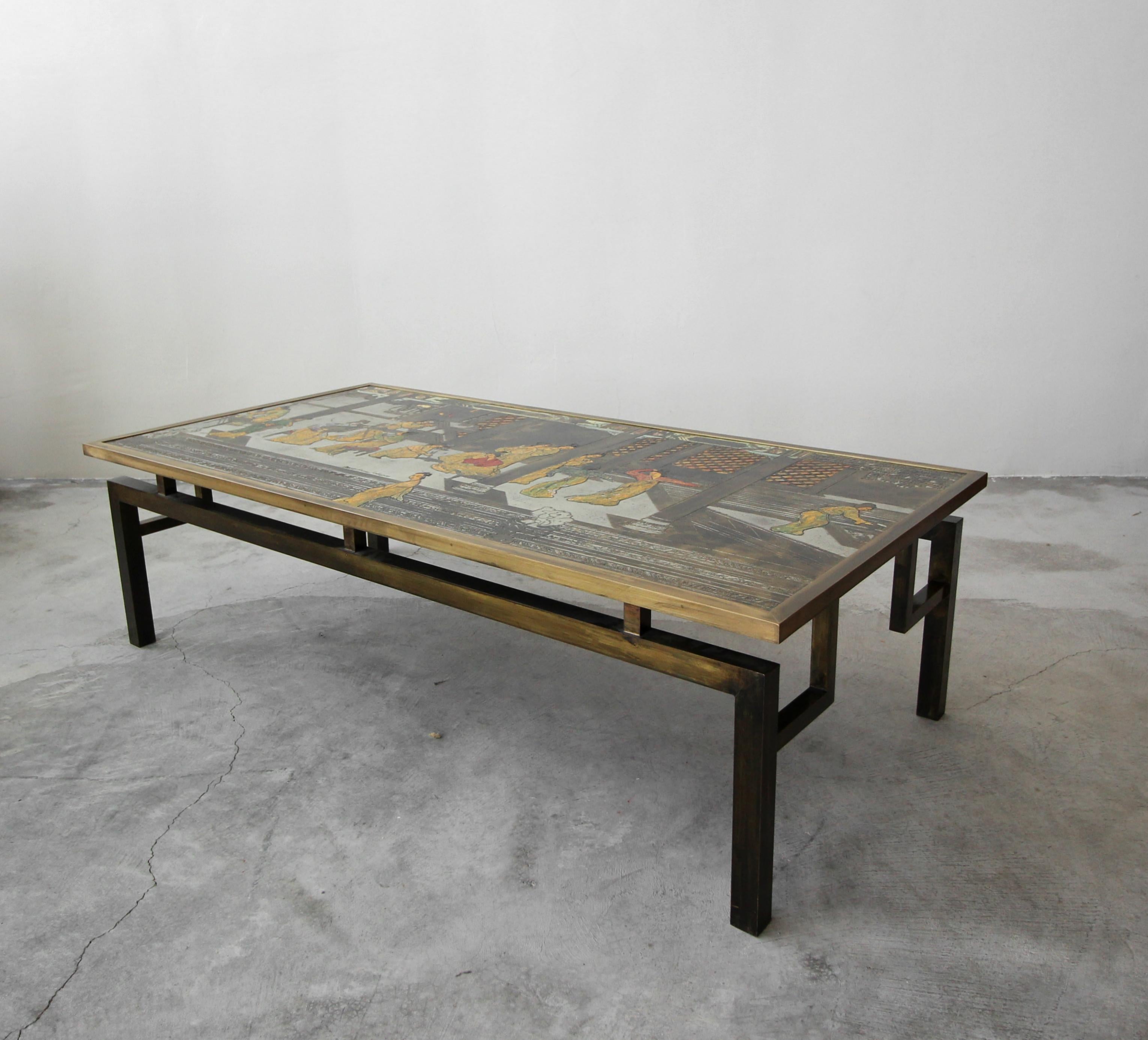 Rare signed bronze Chin Ying coffee table by Philip and Kelvin LaVerne. Table features beautifully patinated, etched bronze and pewter with hand applied enamel.

The table is in overall excellent condition with age appropriate patina. As typical