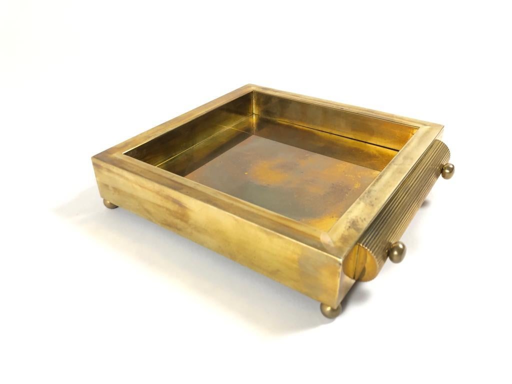 In the style of Gabriella Crespi gold brass cigarette, pill box for a stylish desk.

1970s, made in Italy. 

This piece is has visible patina on the gold consistent with wear and use.

An amazing and seldom piece.

Measures: Width 18
