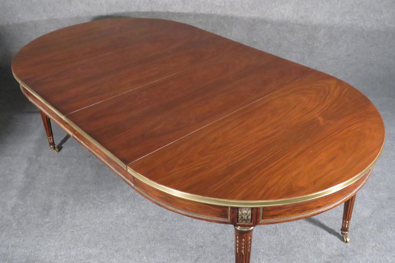 Rare Signed Maison Jansen Louis XVI Rosewood Brass Banded Ormolu Dining Table In Good Condition In Swedesboro, NJ