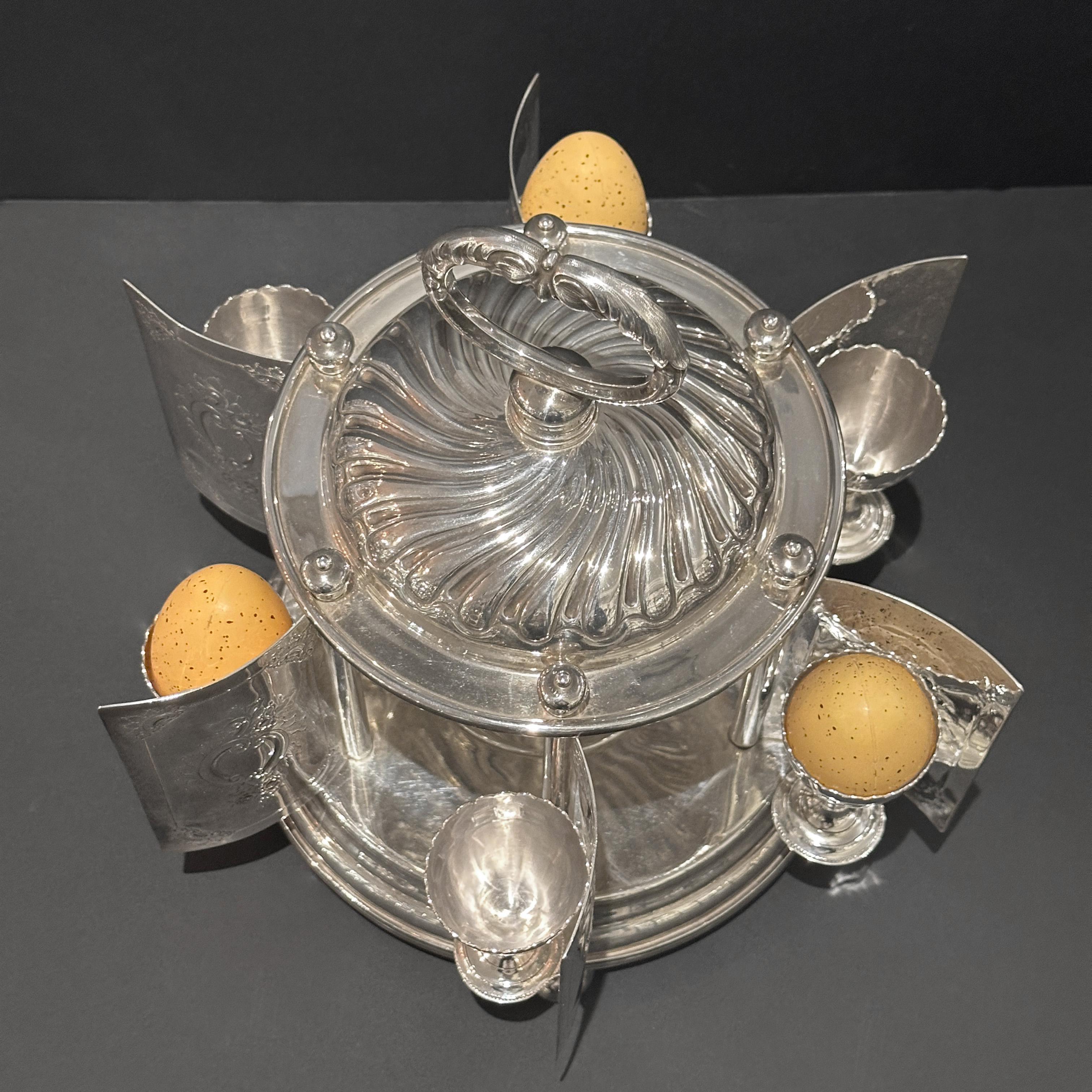 English Rare silver plated egg carrousel, Mappin and Webb, London