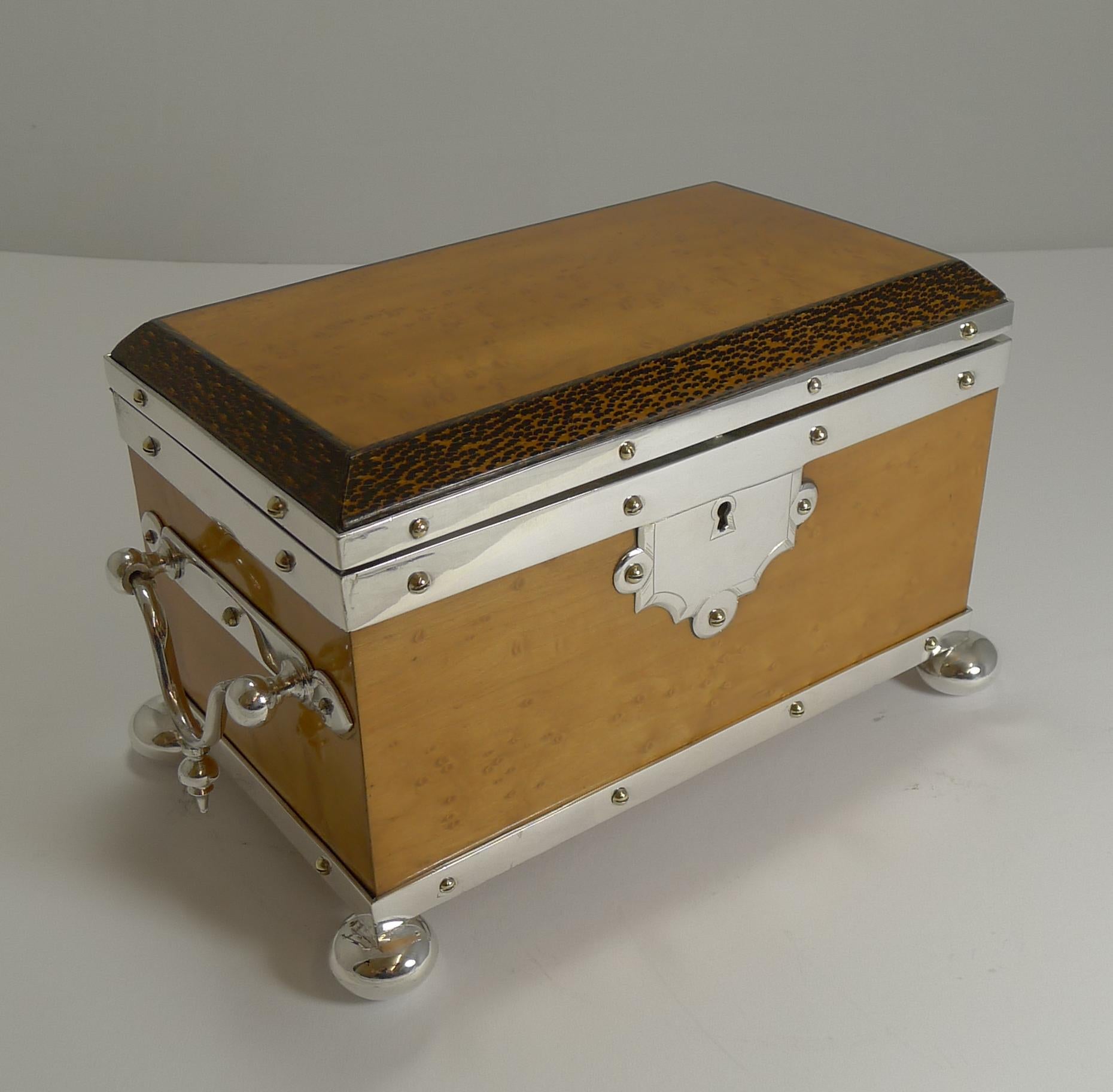 A rare find, I have never come across this tea caddy before. This style of caddy from this late Victorian period is usually made from oak with the silver plated fittings.

This one is made from a winning combination of bird's-eye maple trimmed in