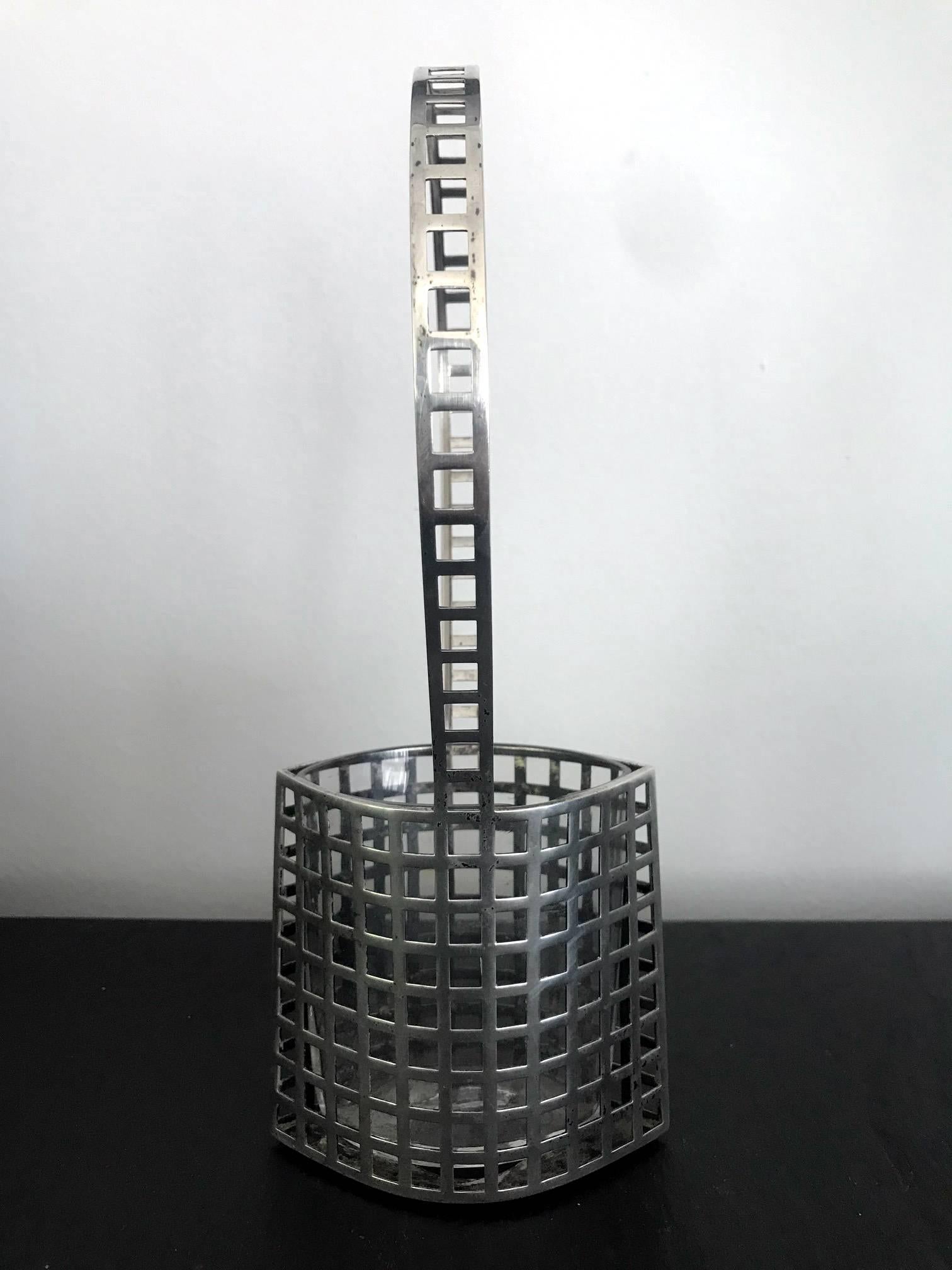 A Wiener Werkstatte silver reticulated flower basket with original glass insert in a very rare model made with silver. Designed by Josef Hoffmann (Austrian, 1870-1956), Vienna, circa 1906 and produced by the Wiener Werkstatte from 1906-1916 in