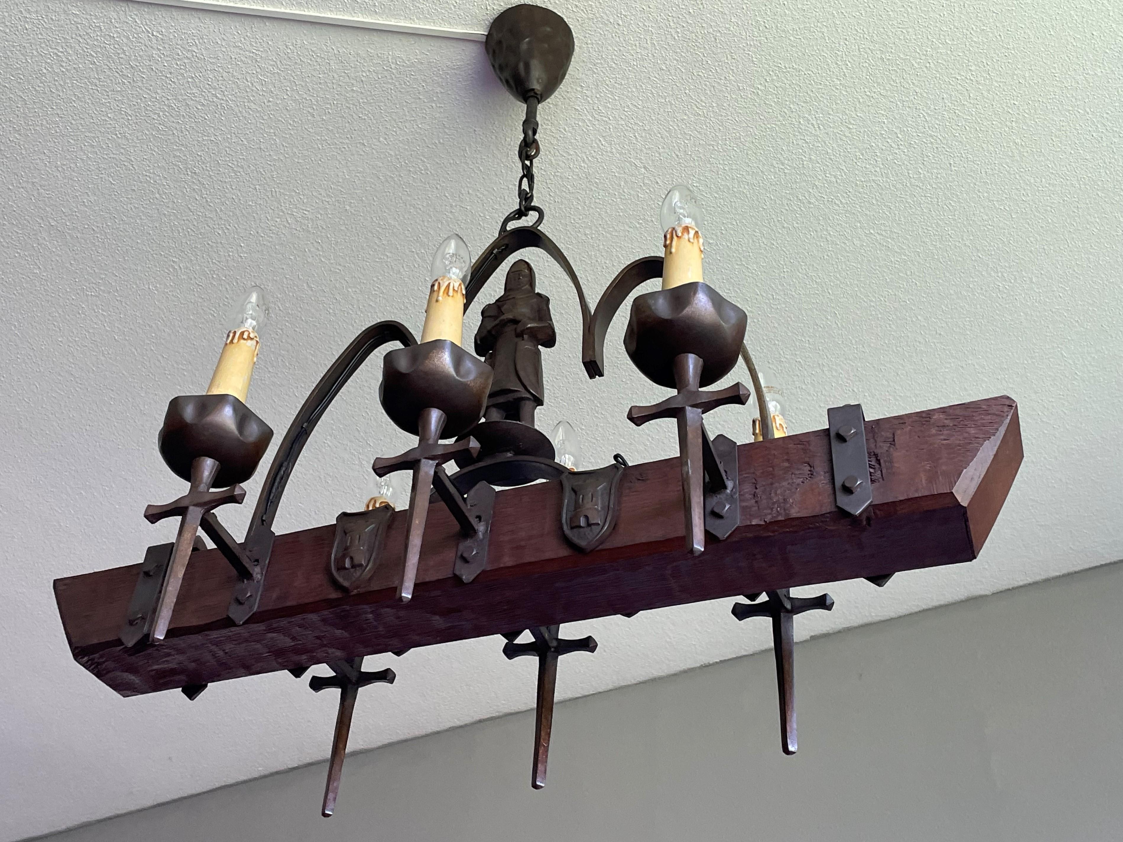 Highly decorative, wrought iron, cast iron & oak Medieval Style chandelier.

With 20th century lighting as one of our specialities, we have seen a lot of great and unique fixtures, but never before did we come across an antique handcrafted Mediëval