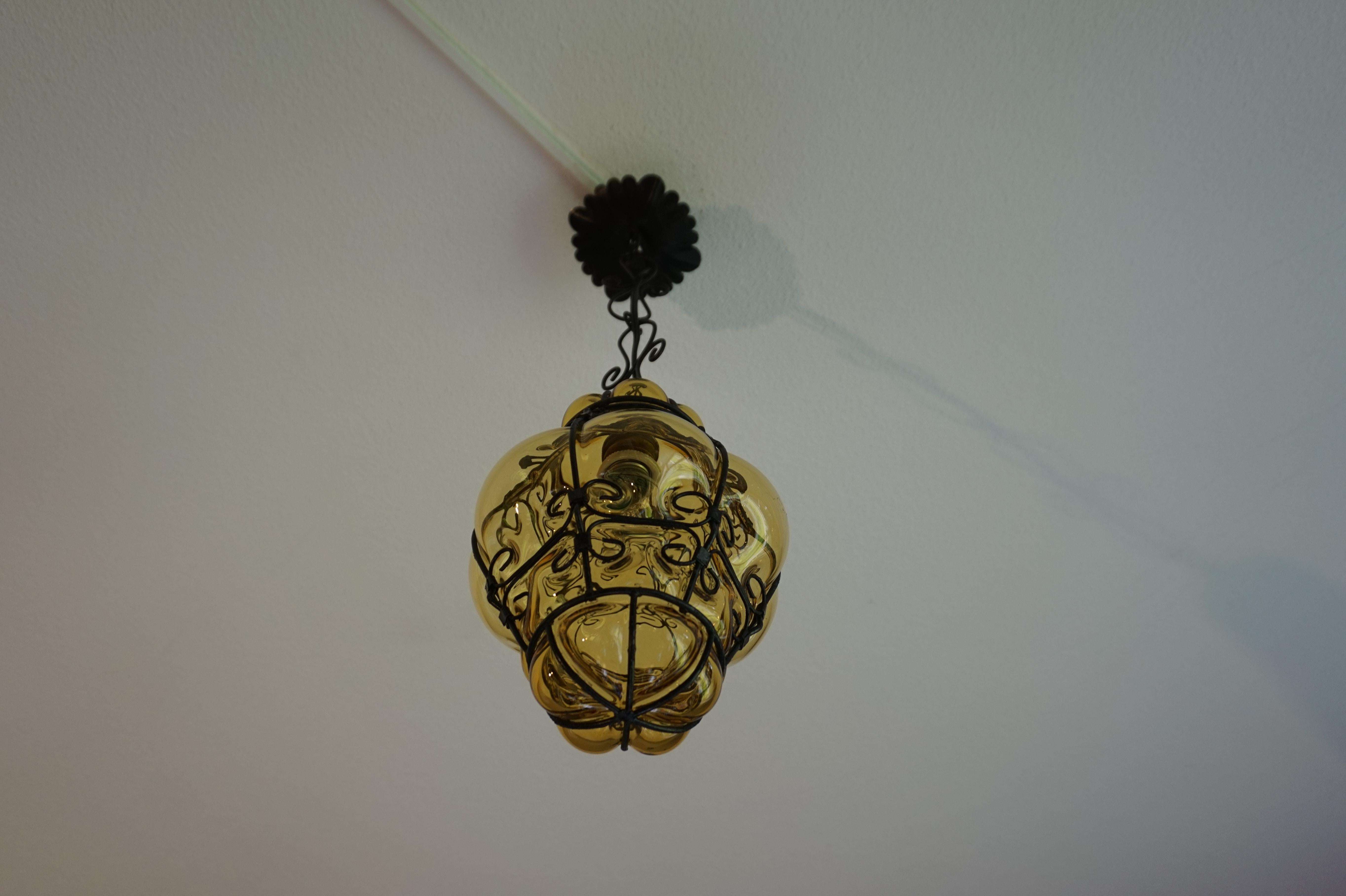 Blackened Rare Size Amber Colored Mouthblown Glass in Metal Frame Venetian Murano Pendant For Sale