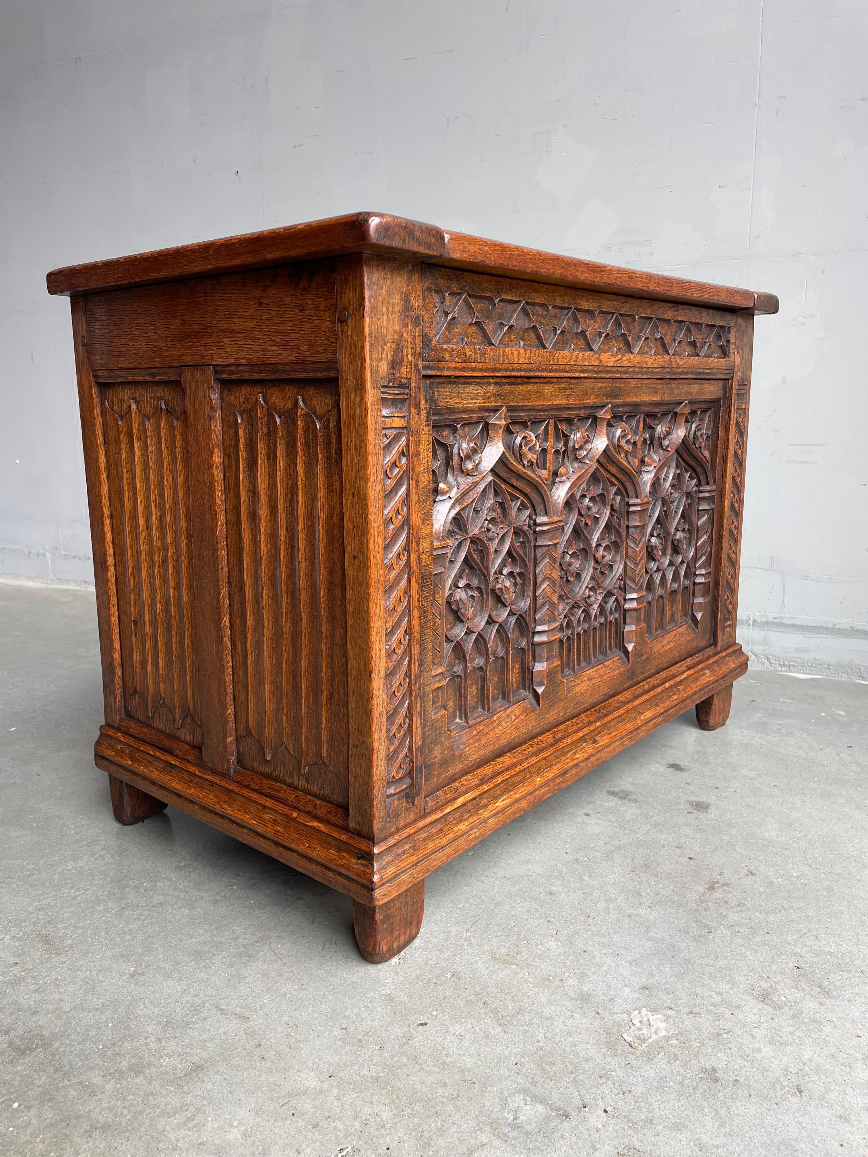 Marvelous, mid 1800s Gothic chest with deepest hand carved, church window-like panels.

Because of the quality and the depth of the carvings, the beautiful overall design and the striking solid oak structure we feel that this stylish and practical