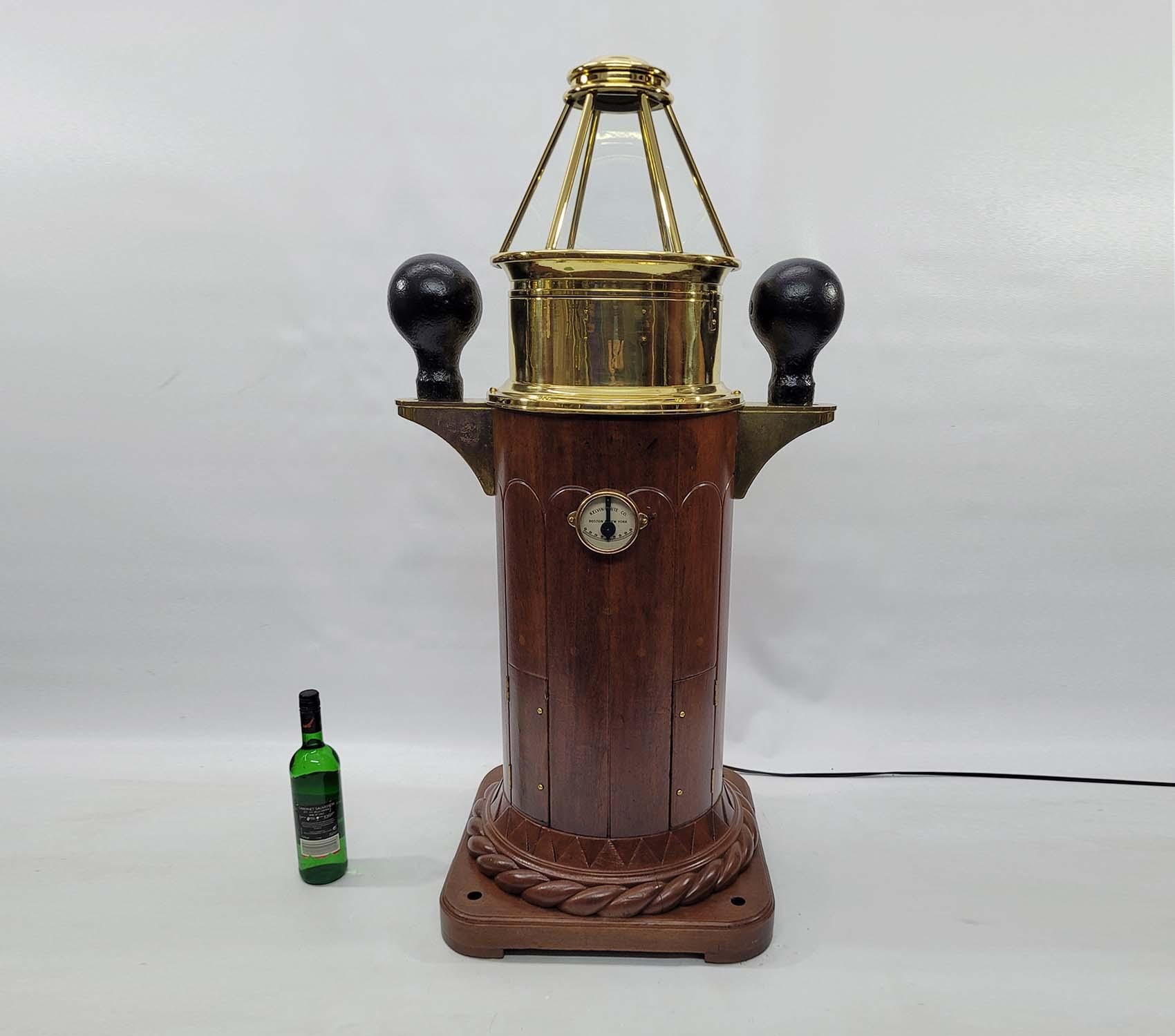 Fine early 20th Century Skylight Yacht Binnacle. Amazing wood base with intricate rope carving and varnish and varnish finish. The six-sided Skylight top houses. A gimballed Compass. Iron compensating balls are mounted to brackets. 

Weight: 110