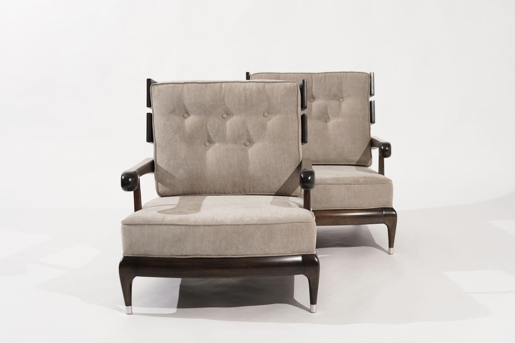 Widdicomb 1950s Lounge Chairs, meticulously restored by Stamford Modern to embody the quintessence of mid-century design. These chairs are an aesthetic delight, seamlessly blending a striking slate backrest with a plush, low-profile seating for an