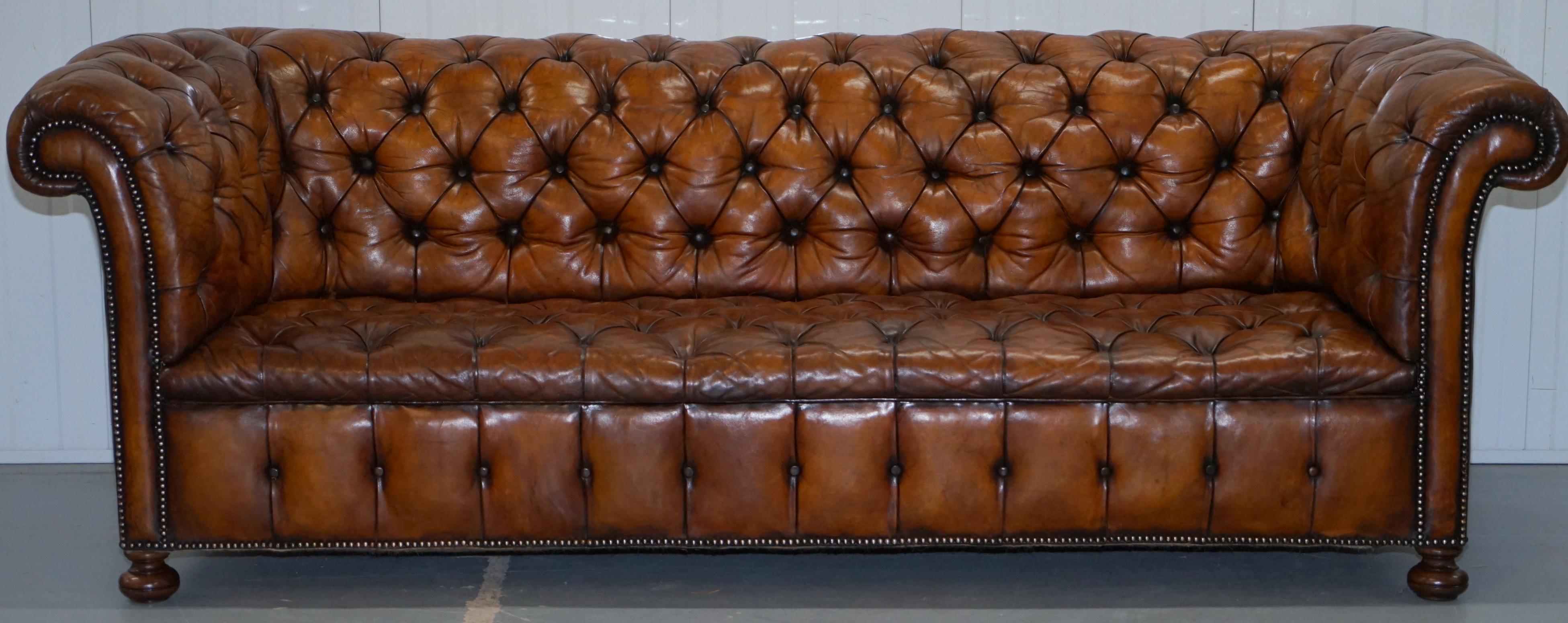 We are delighted to offer for sale this very rare fully restored circa 1860 hand dyed Whiskey brown leather Chesterfield sofa with original horse hair padding and coil sprung all over

This sofa is actually a very rare model, it is fully sprung