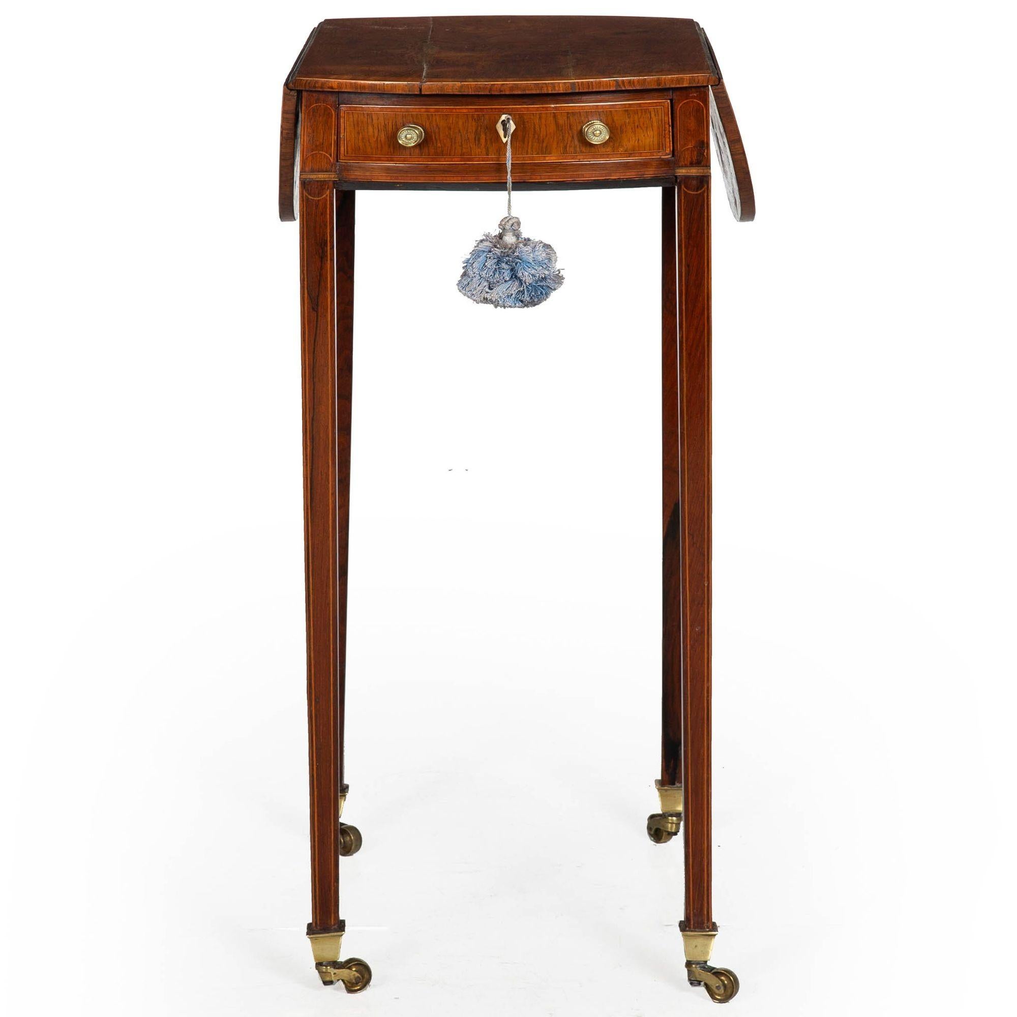 RARE DIMINUTIVE GEORGE III ROSEWOOD AND SATINWOOD-INLAID OVULAR PEMBROKE TABLE OF THE SHERATON PERIOD
England, circa 1795
Item # 403LRB02A

A fine and rare George III drop-leaf pembroke table of the Sheraton Period, this example is characterized by