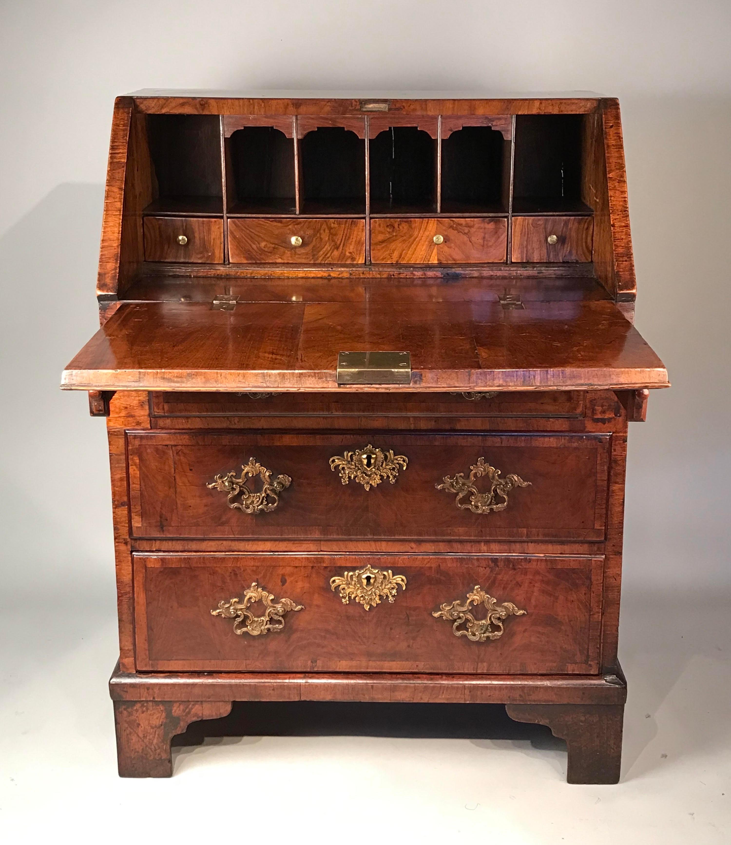 A rare antique English walnut bureau of compact proportions. Mid-18th century, circa 1740.

Measures: W 2’3''
D 17''
H 36''

BHA 1106

Nb. This rare small size George ll period (1683-1760) walnut bureau remarkably survives in its original