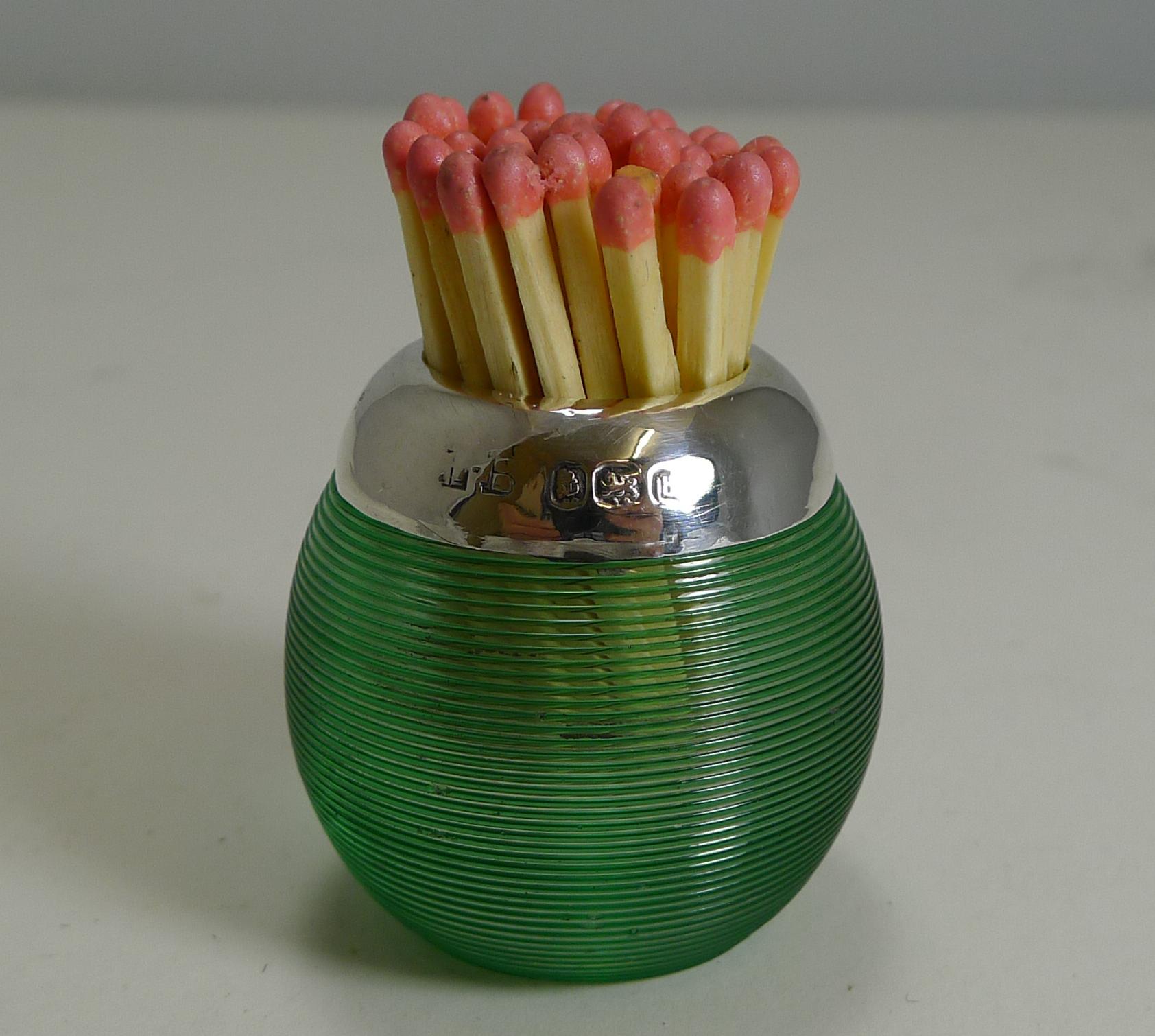 A charming and highly sought-after antique English colored match ball in a stunning green color with a threaded surface for the striking of non-safety matches or Vestas.

The silver mount surrounding the match chamber is hallmarked for Birmingham