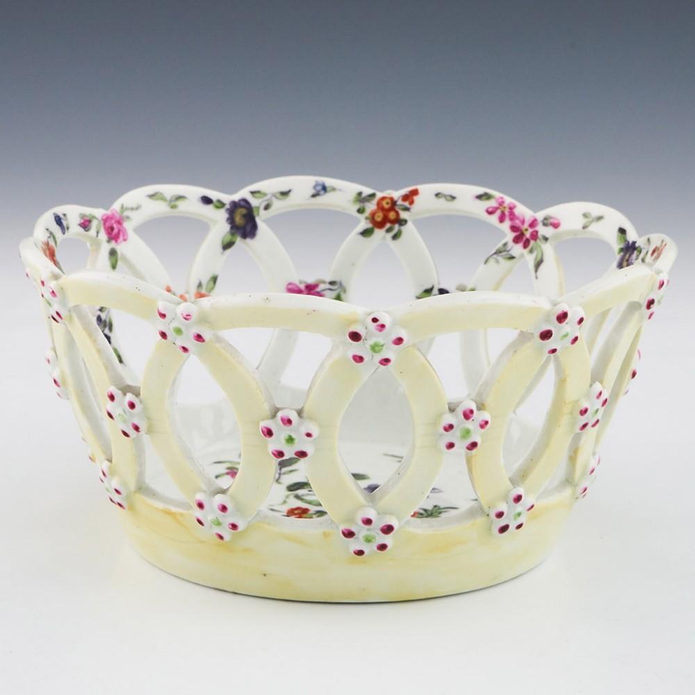 Rare Small Size Yellow Ground First Period Worcester Porcelain Basket, c1760

Circular baskets with the sides made from interlocking circles were first made by Worcester in 1758. The florets on the external surfaces are not merely decorative - they
