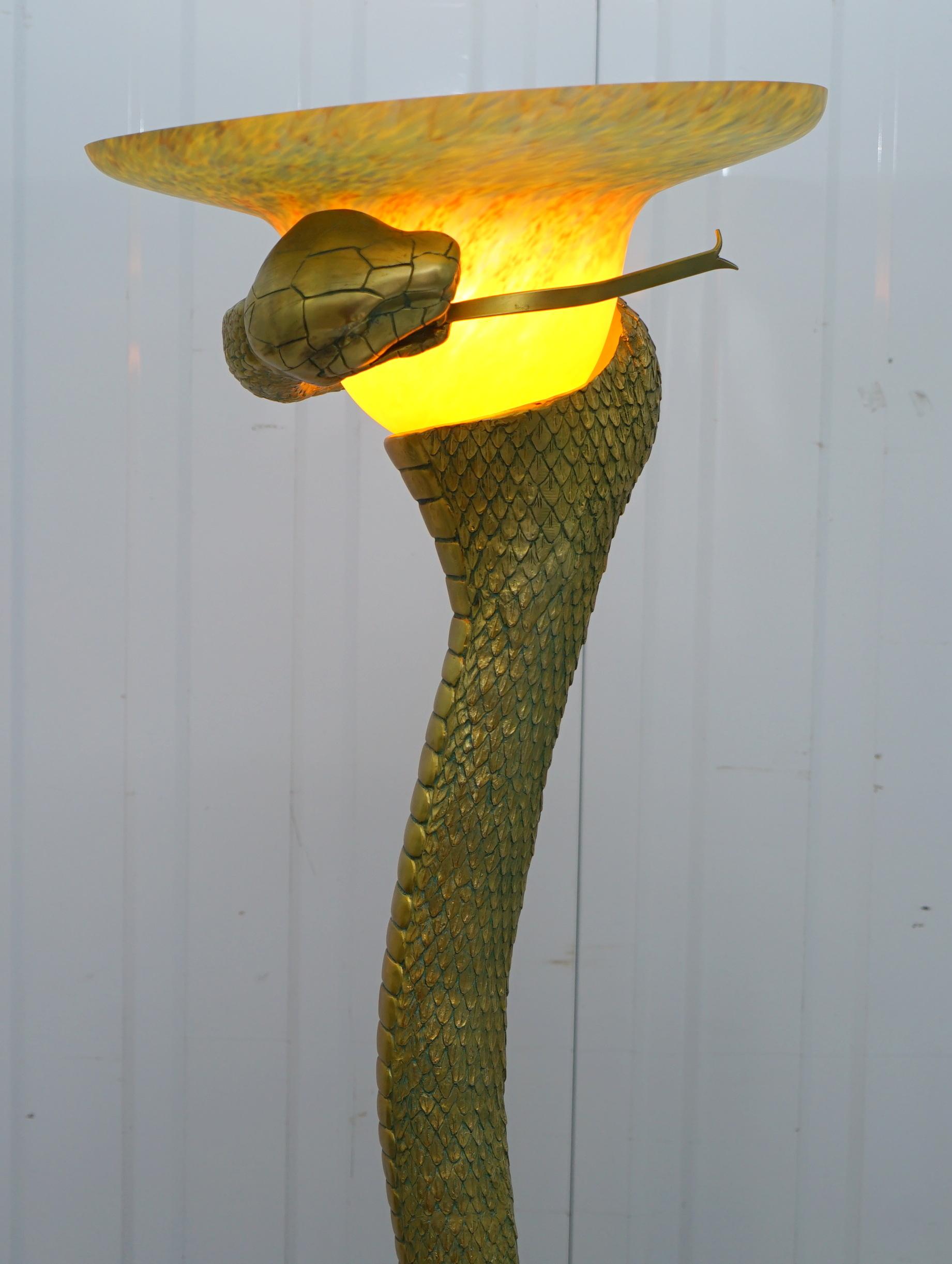 We are delighted to offer for sale this very rare floor standing snake lamp after the original by Edgar Brandt which sold in 1994 at Christies for $76,000

A very good looking and decorative piece, the original sold as above for $76,000 just over