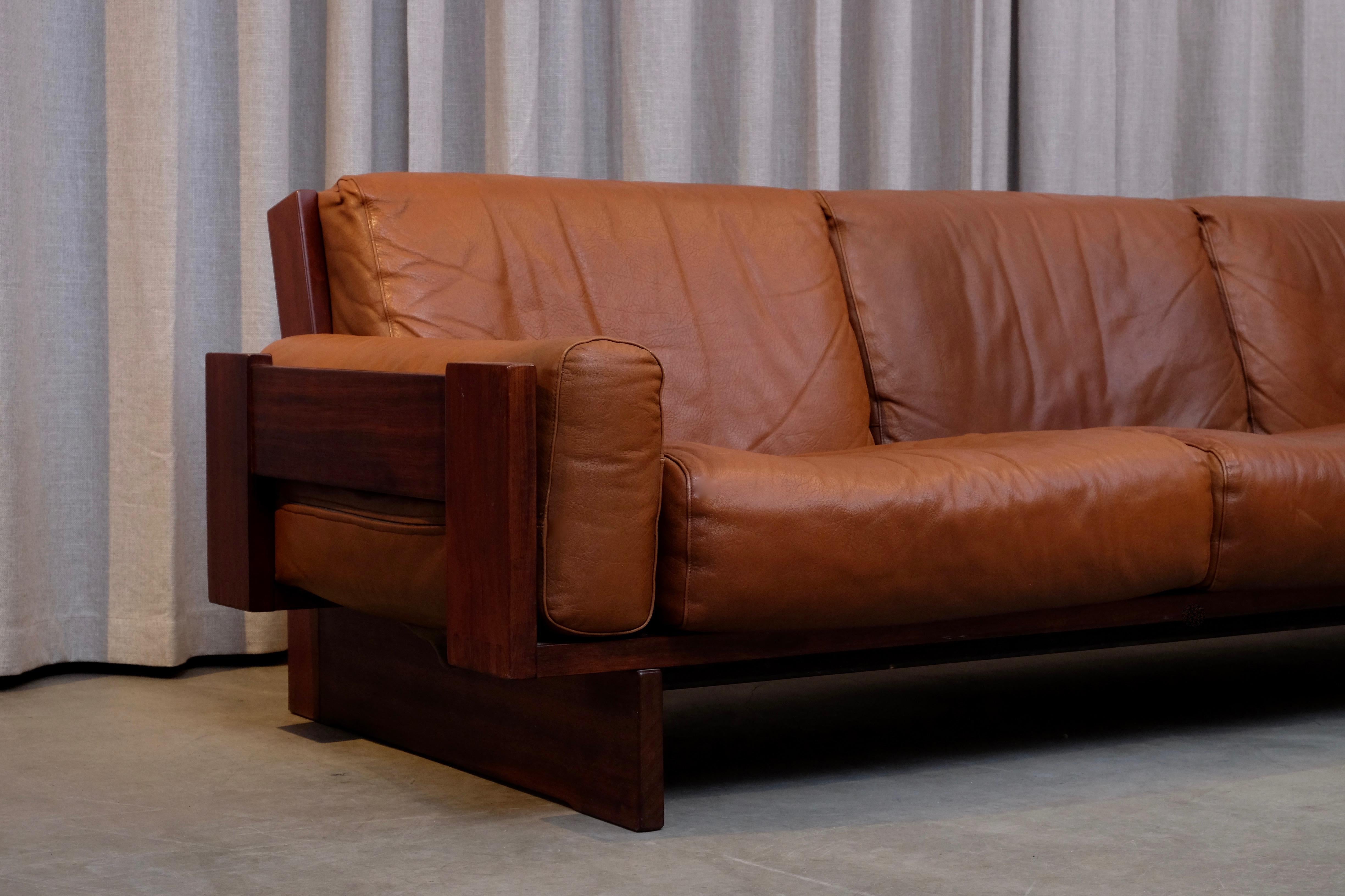 - 3-seat, 230 cm (Please note: a single 2-seat is also available, see picture (163 cm)
- Afromosia and original cognac brown leather with perfect patina
- Designed 1967
- Produced by Stranda industri / Bruksbo in Norway, 1960s.
 