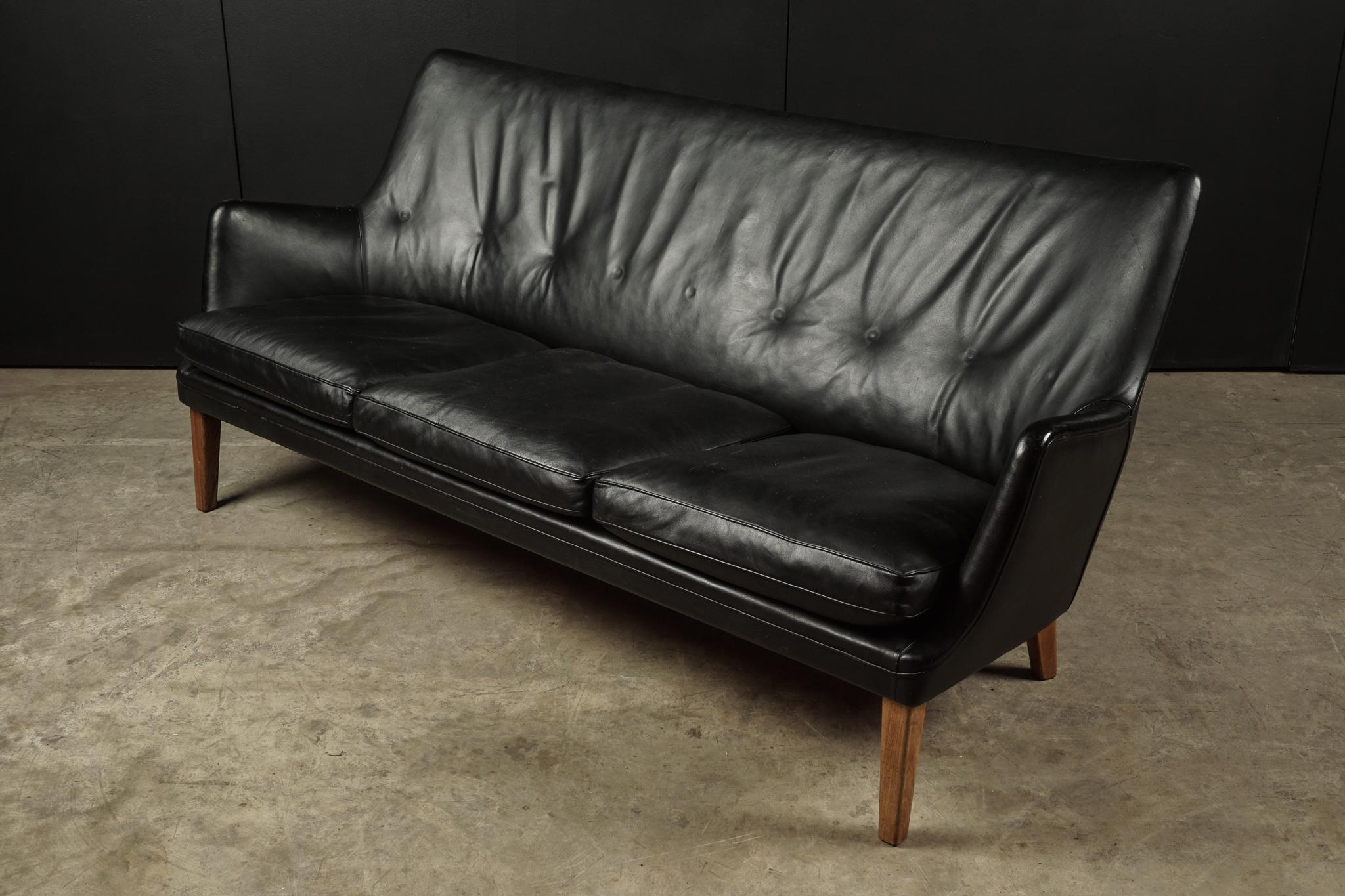 Rare midcentury leather sofa designed by Arne Vodder, Denmark, circa 1960. Original black leather upholstery. Produced by Ivan Schlechter, Denmark.