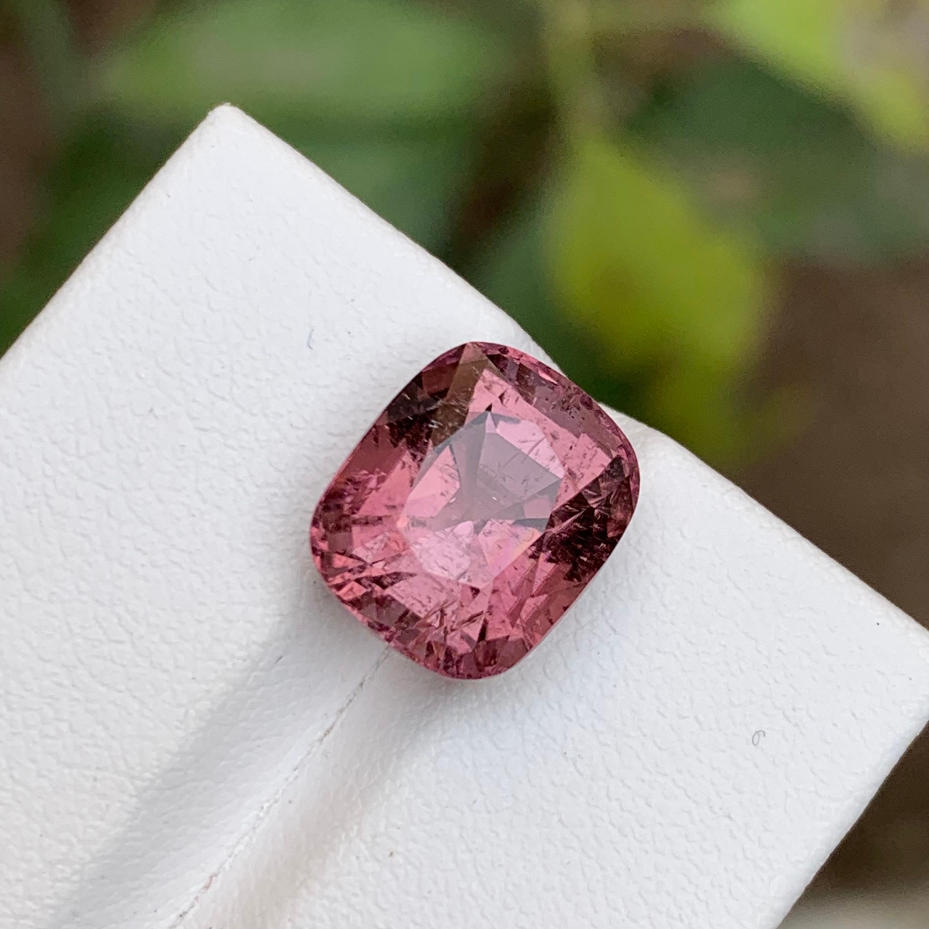 GEMSTONE TYPE: Tourmaline
PIECE(S): 1
WEIGHT: 7.50 Carats
SHAPE: Cushion 
SIZE (MM): 11.80 x 9.79 x 8.90
COLOR: Soft Pink
CLARITY: Slightly Included 
TREATMENT: Heated
ORIGIN: Afghanistan
CERTIFICATE: On demand

Behold a masterpiece of nature, a