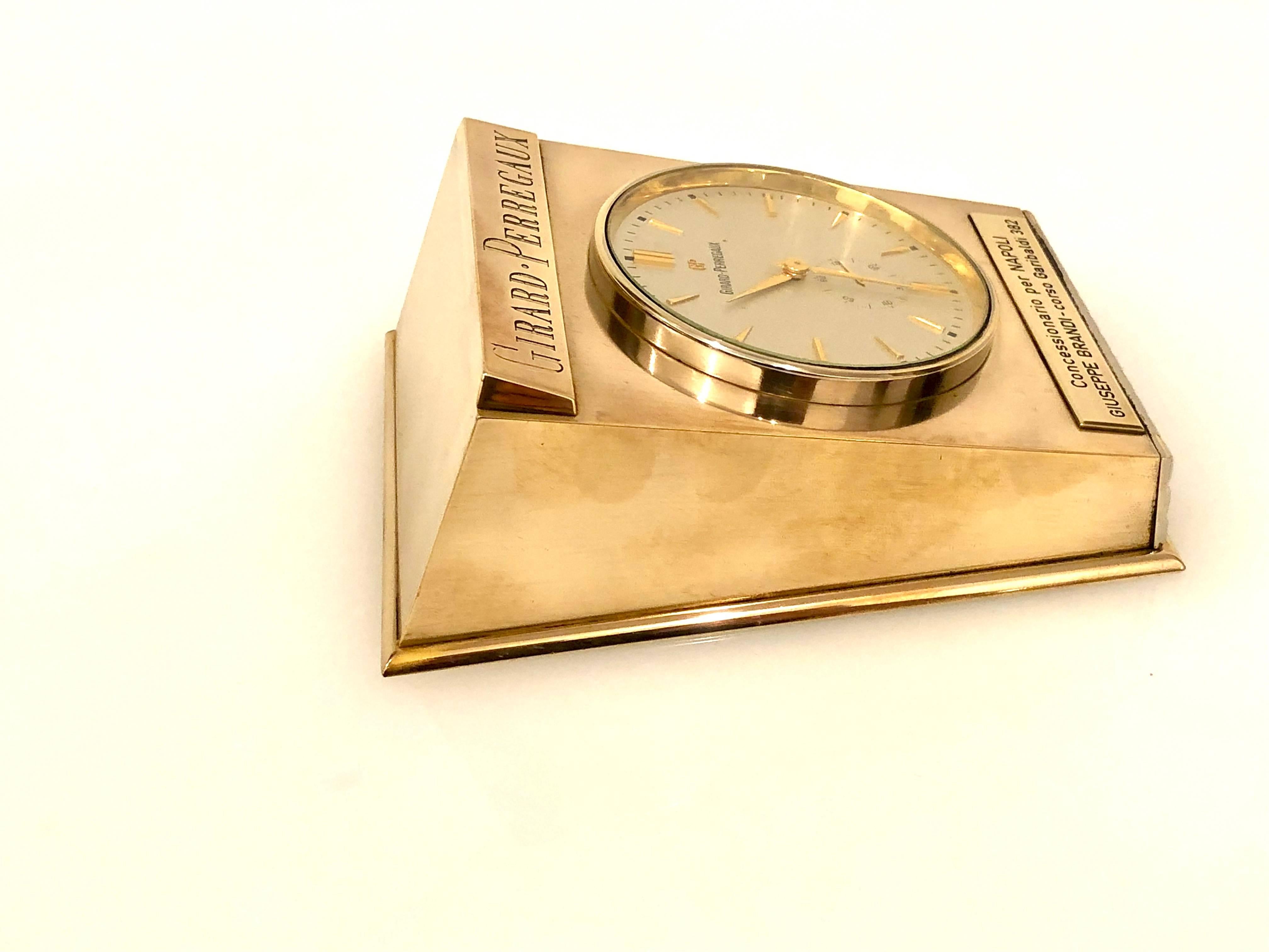 A very rare table clock in polished brass finish, with applied makers and minute indicator, sub seconds, circa 1970s in great condition with plaque on the bottom from an Italian distributor.